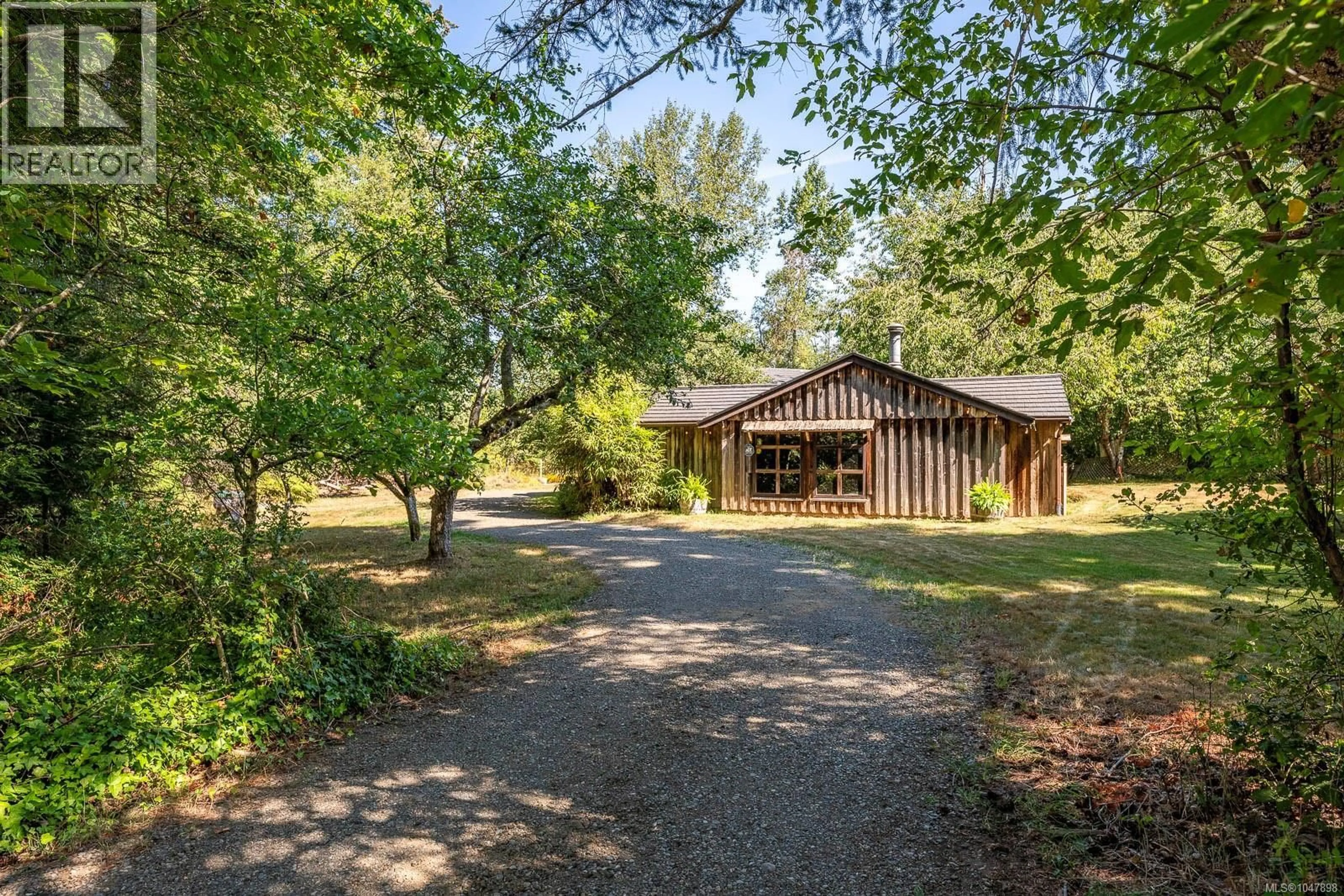 A pic from outside/outdoor area/front of a property/back of a property/a pic from drone, forest/trees view for 2496 BACK ROAD, Courtenay British Columbia V9J9G8