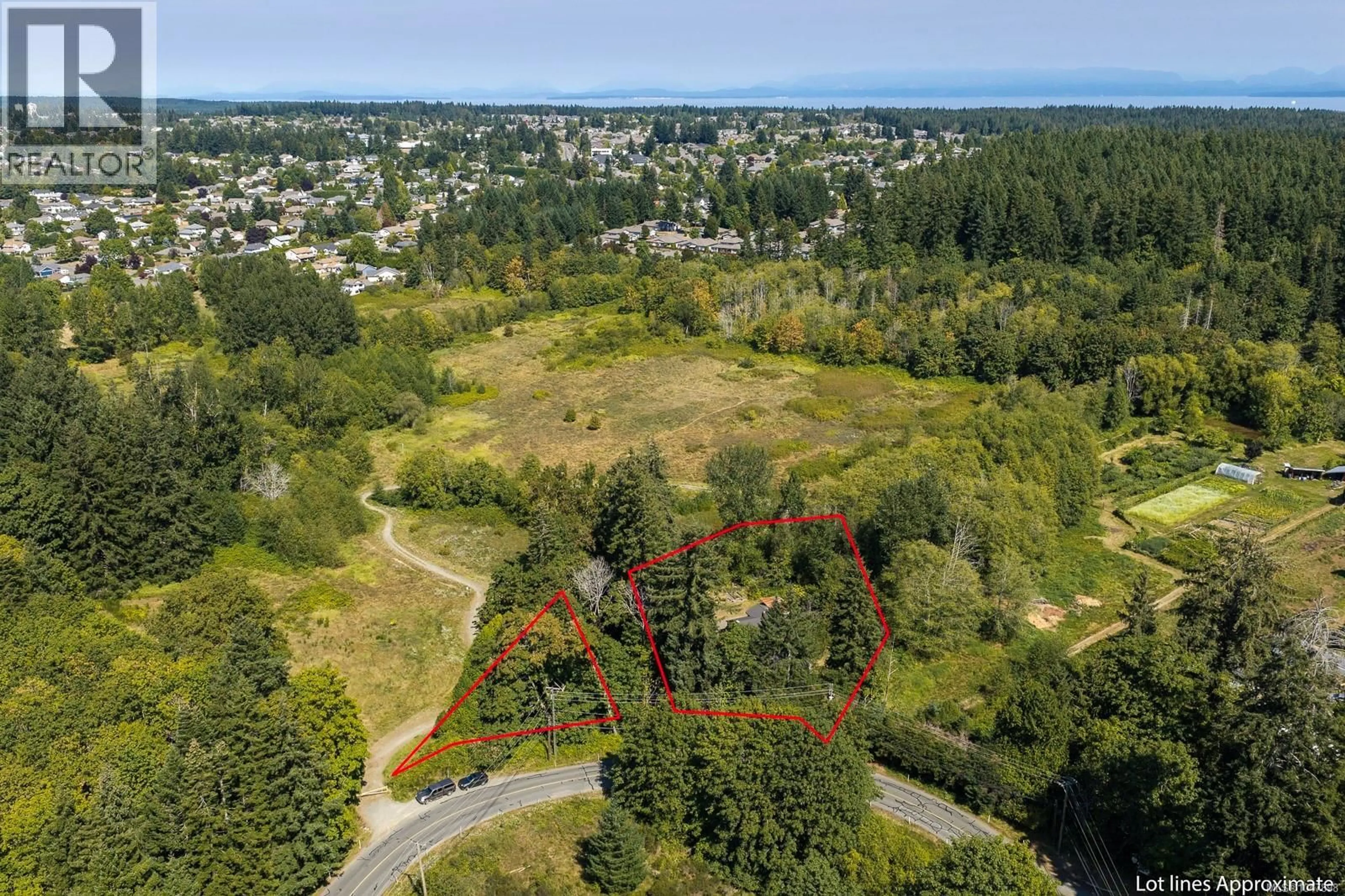 A pic from outside/outdoor area/front of a property/back of a property/a pic from drone, forest/trees view for 2496 BACK ROAD, Courtenay British Columbia V9J9G8