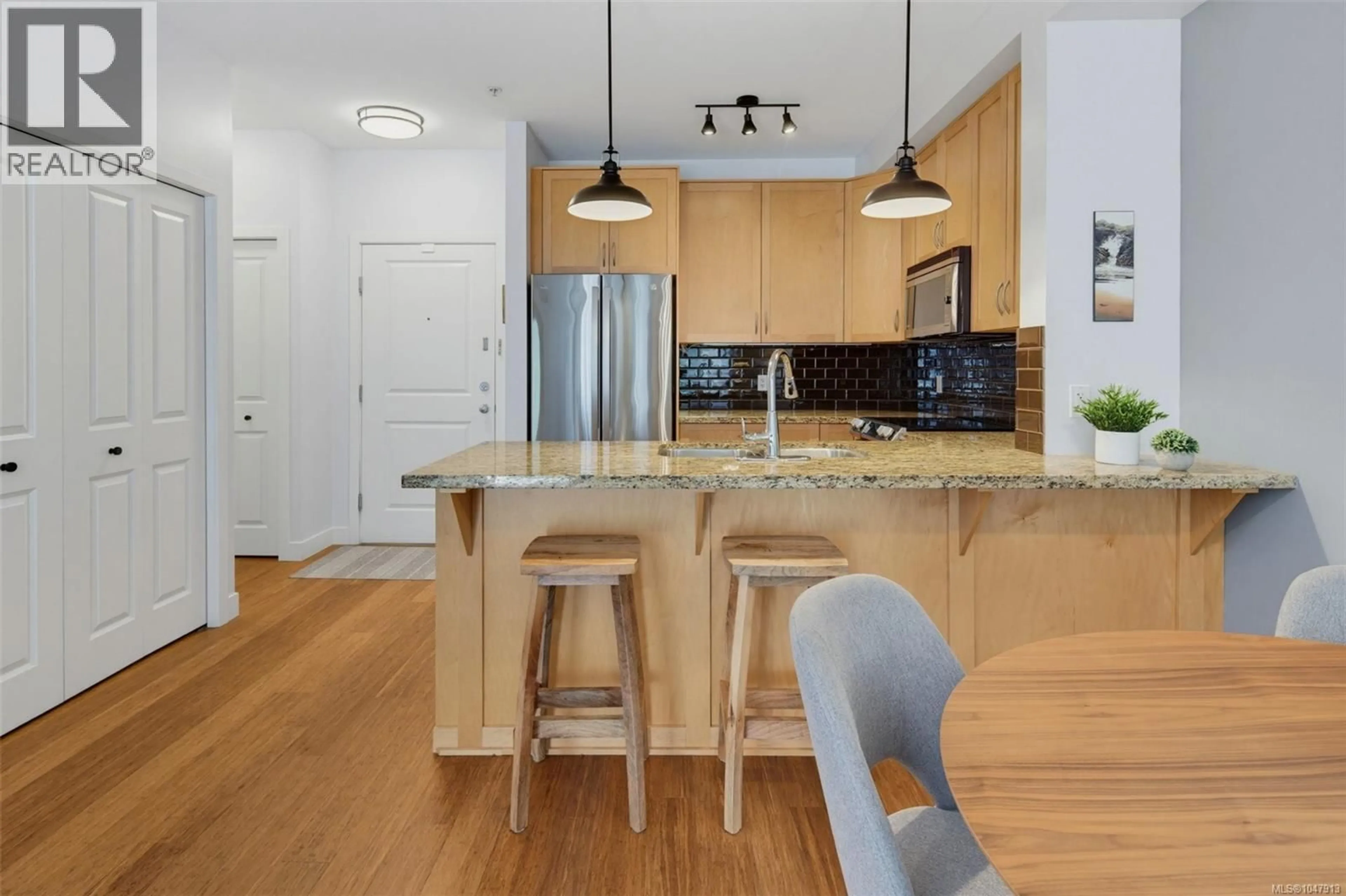 Open concept kitchen, wood/laminate floor for 211 - 611 GOLDSTREAM AVENUE, Langford British Columbia V9B2W9