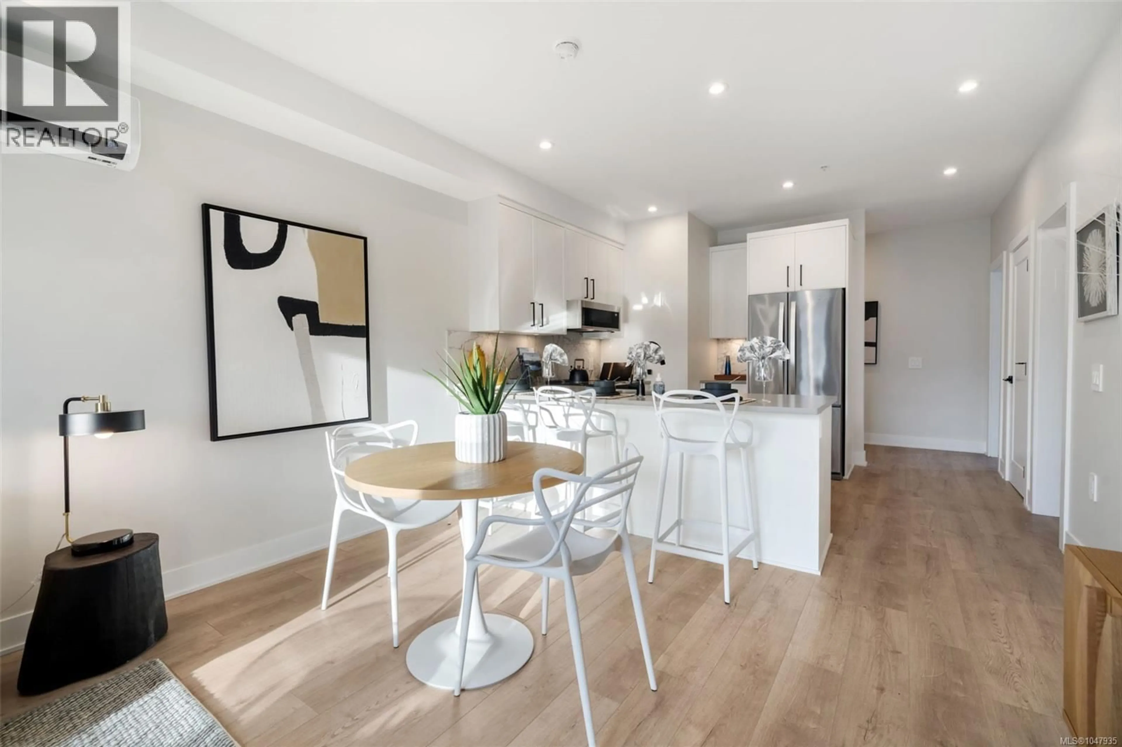 Open concept kitchen, wood/laminate floor for 602 - 1371 GOLDSTREAM AVENUE, Langford British Columbia V9B7B7