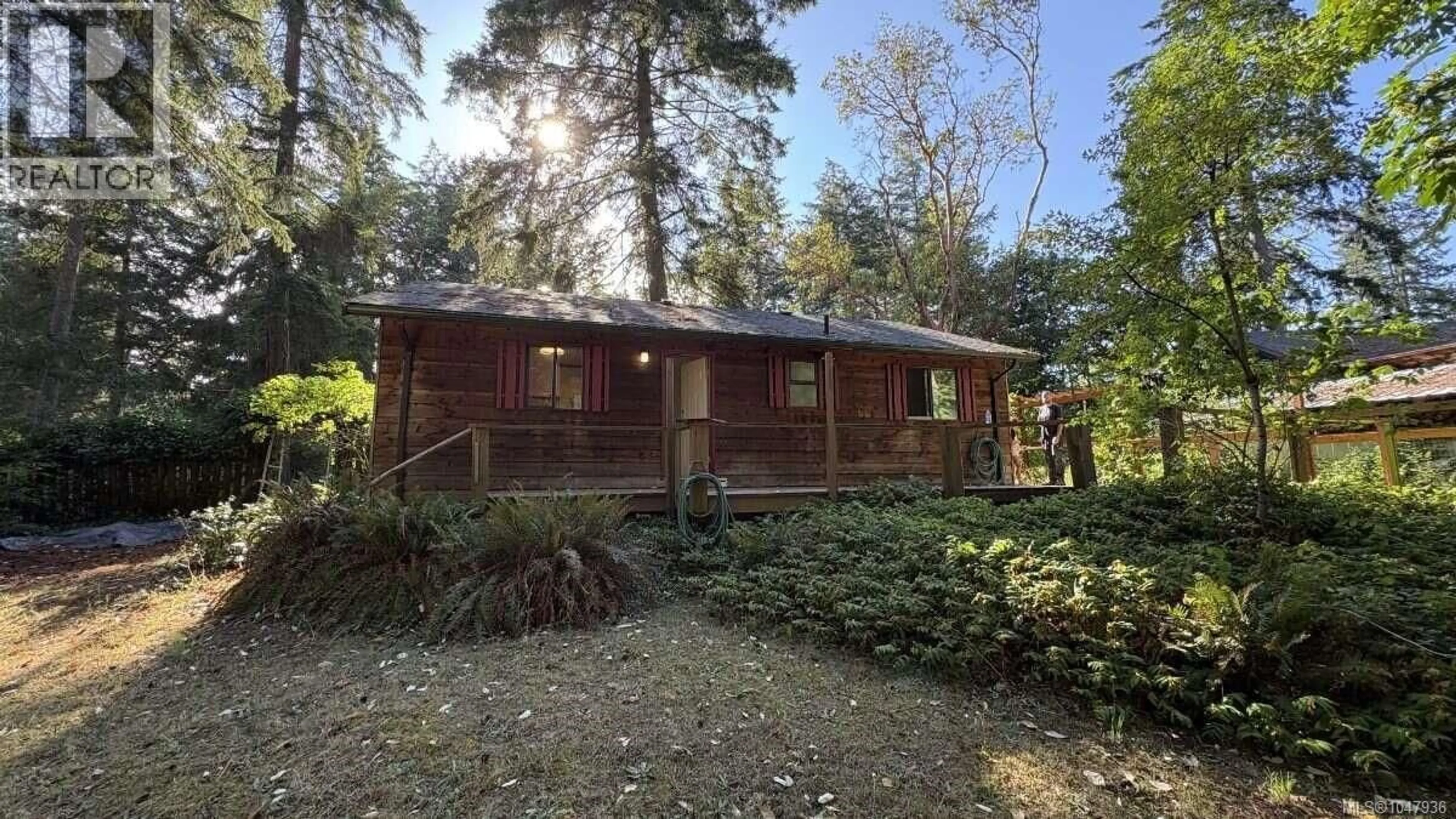 A pic from outside/outdoor area/front of a property/back of a property/a pic from drone, forest/trees view for 23 PIRATES LANE, Protection Island British Columbia V9R6R1