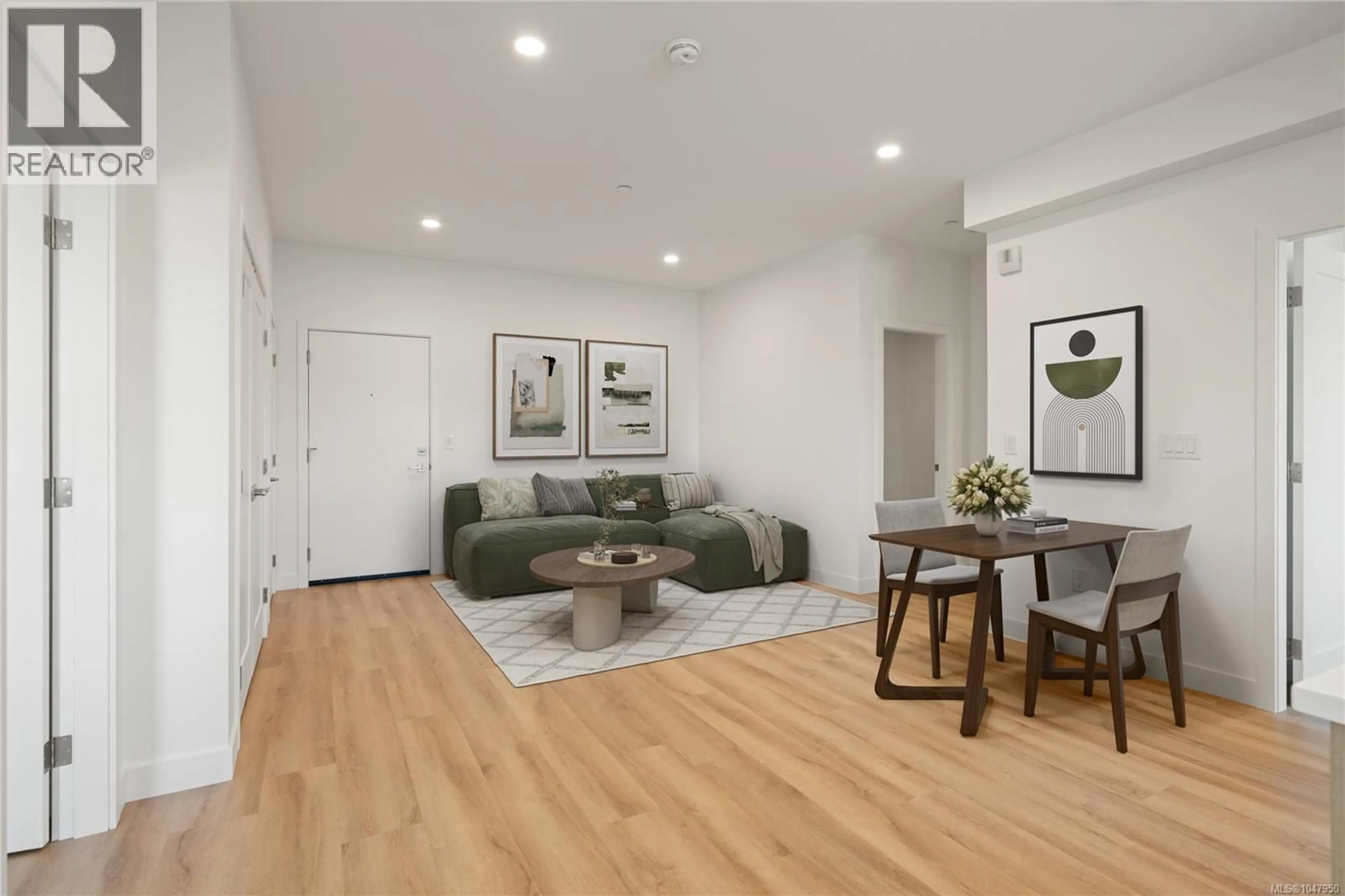 Living room with furniture, wood/laminate floor for 204 - 7181 LANTZVILLE ROAD, Lantzville British Columbia V0R2H0