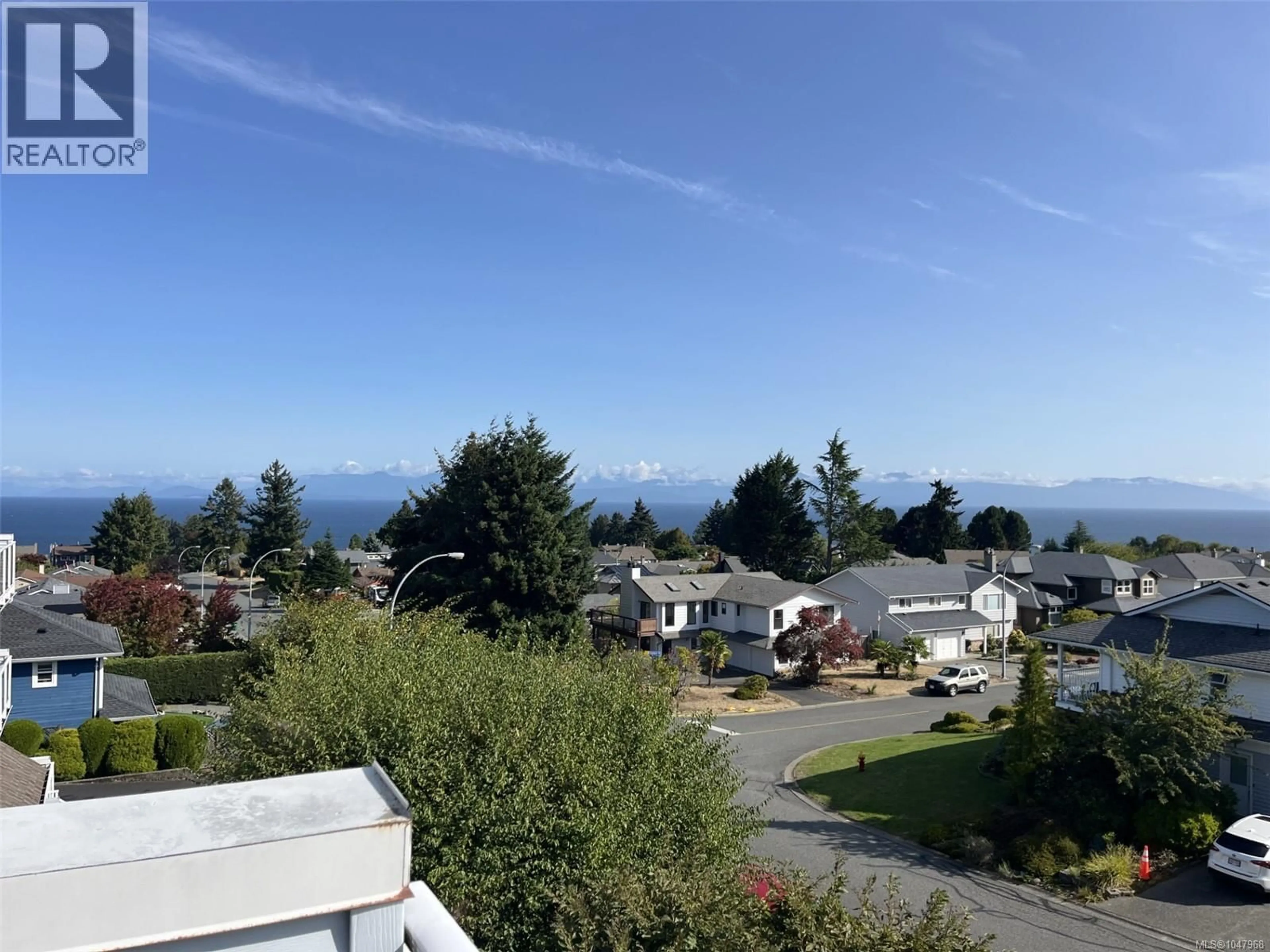 A pic from outside/outdoor area/front of a property/back of a property/a pic from drone, mountain view for 212A - 6231 BLUEBACK ROAD, Nanaimo British Columbia V9V1J3