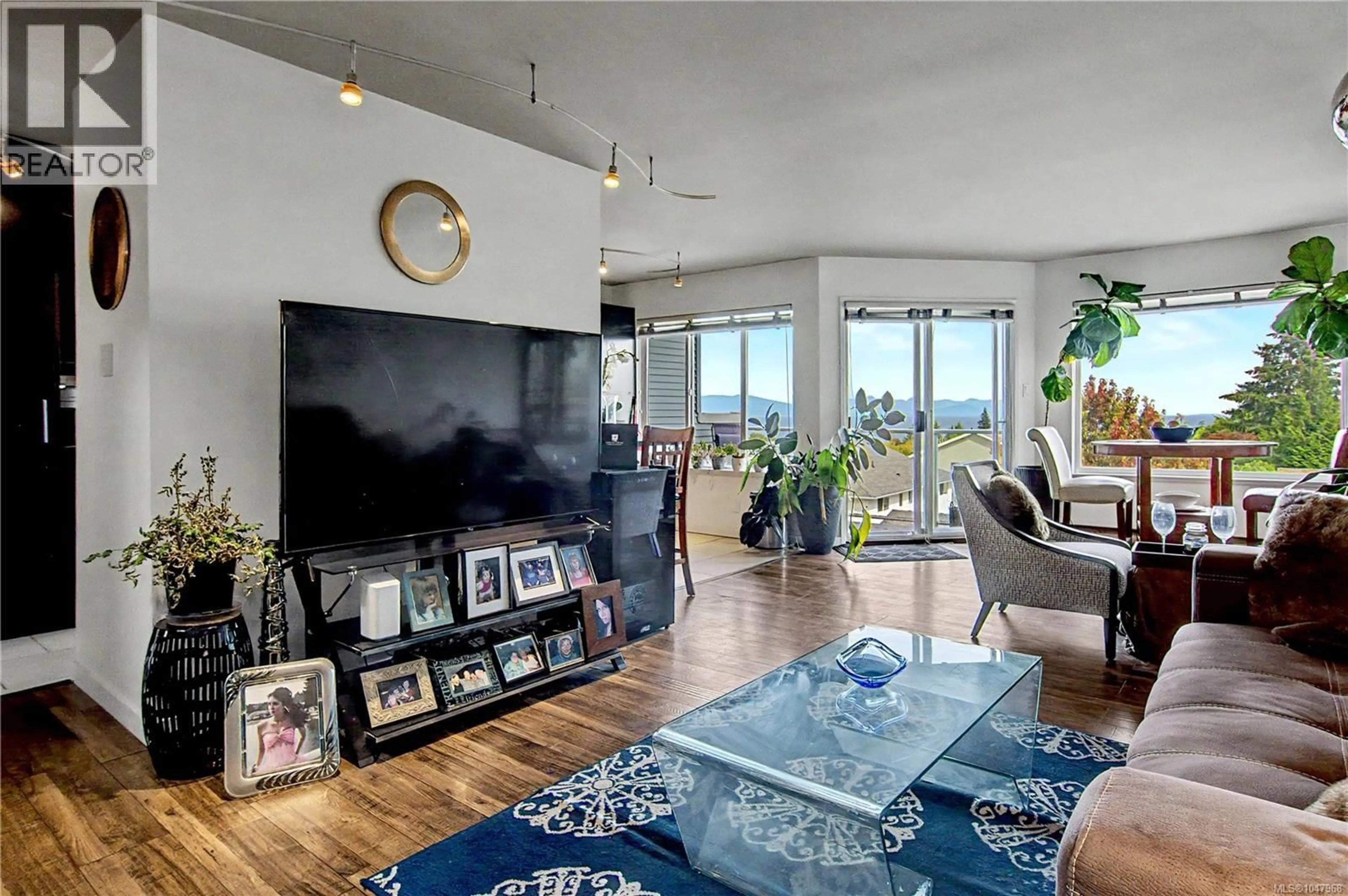 Living room with furniture, unknown for 212A - 6231 BLUEBACK ROAD, Nanaimo British Columbia V9V1J3