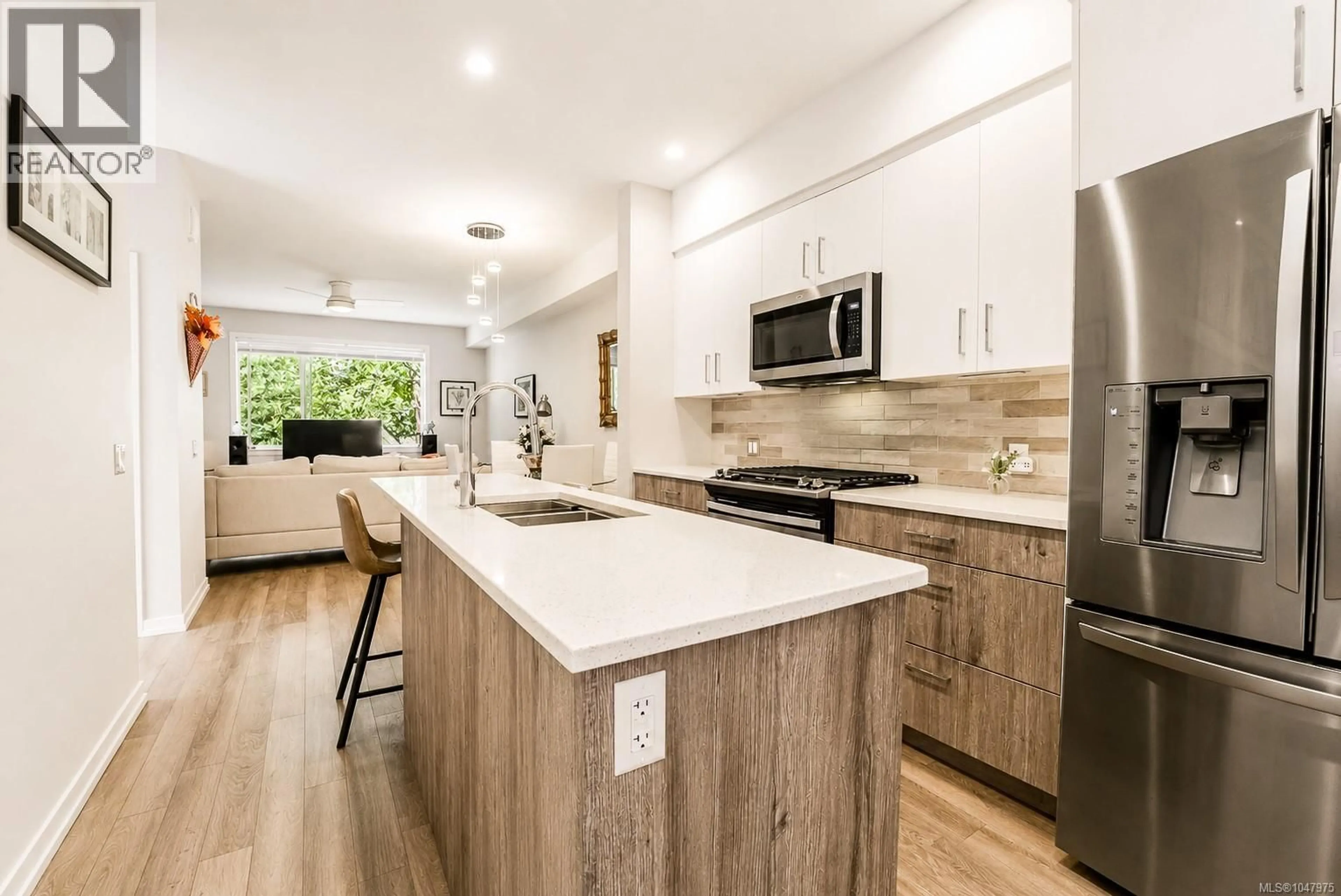 Open concept kitchen, wood/laminate floor for 112 - 694 HOYLAKE AVENUE, Langford British Columbia V9B3P7