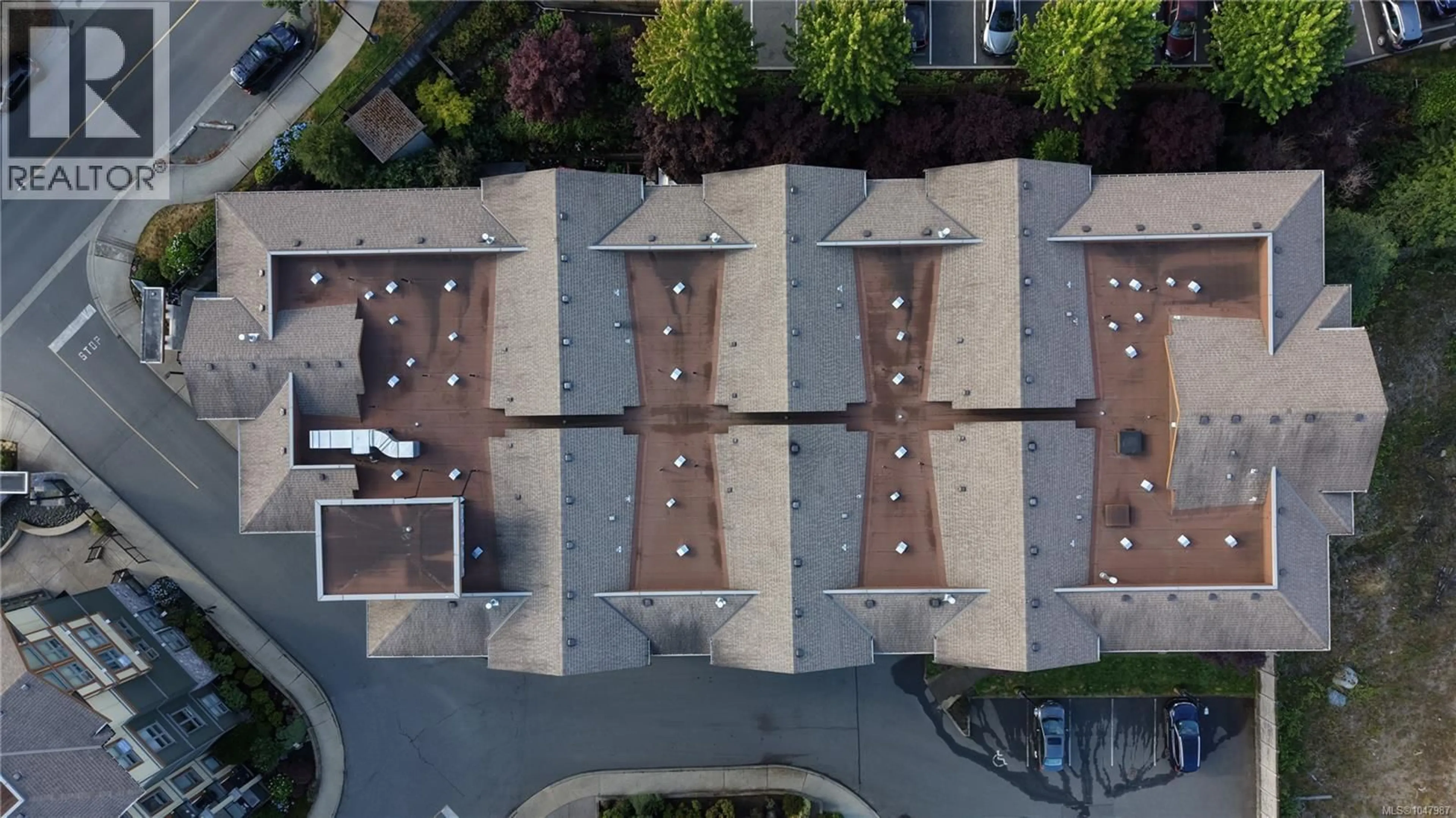 A pic from outside/outdoor area/front of a property/back of a property/a pic from drone, street for 401 - 3226 JACKLIN ROAD SOUTHEAST, Langford British Columbia V9B0J5