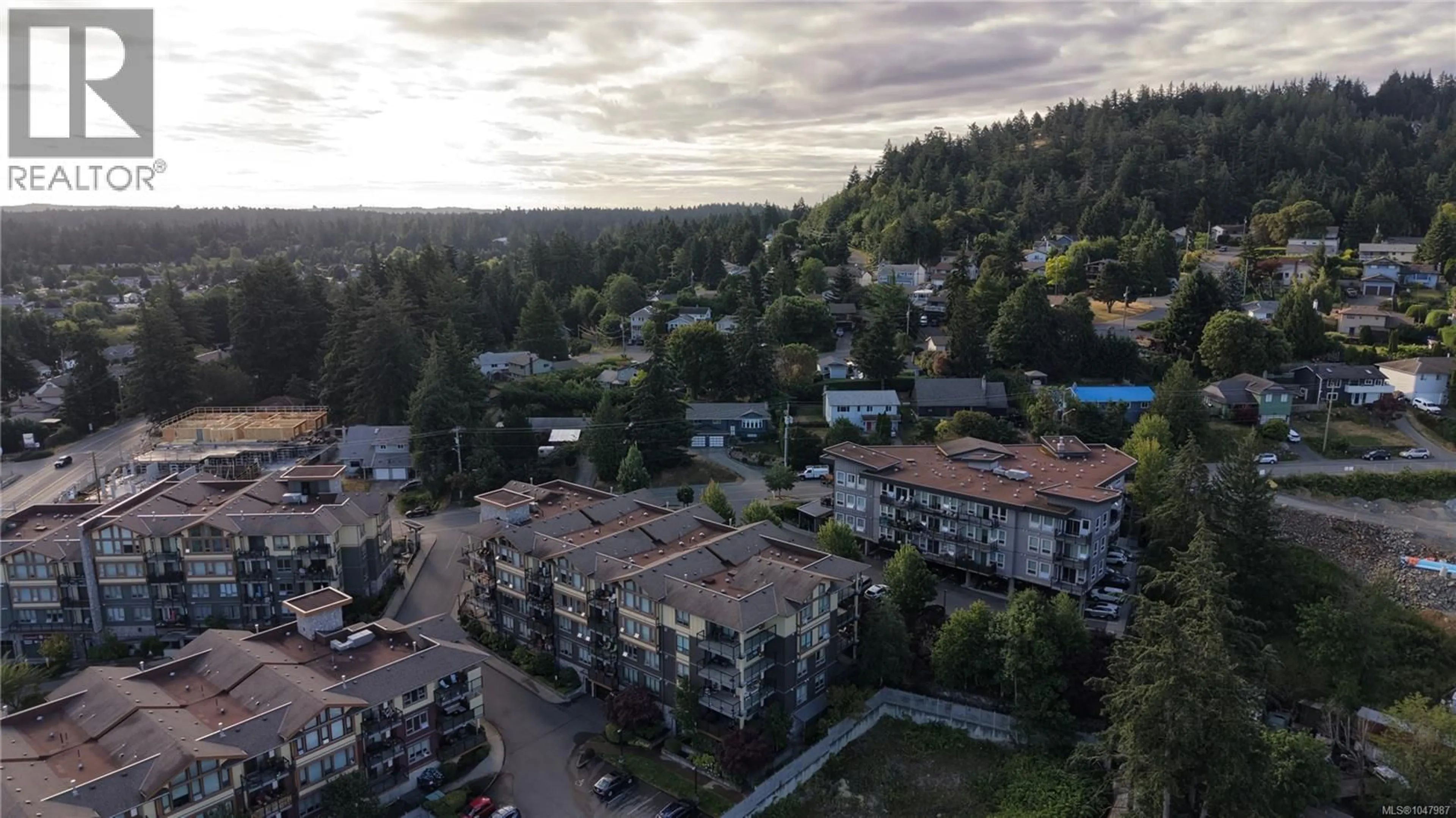 A pic from outside/outdoor area/front of a property/back of a property/a pic from drone, mountain view for 401 - 3226 JACKLIN ROAD SOUTHEAST, Langford British Columbia V9B0J5