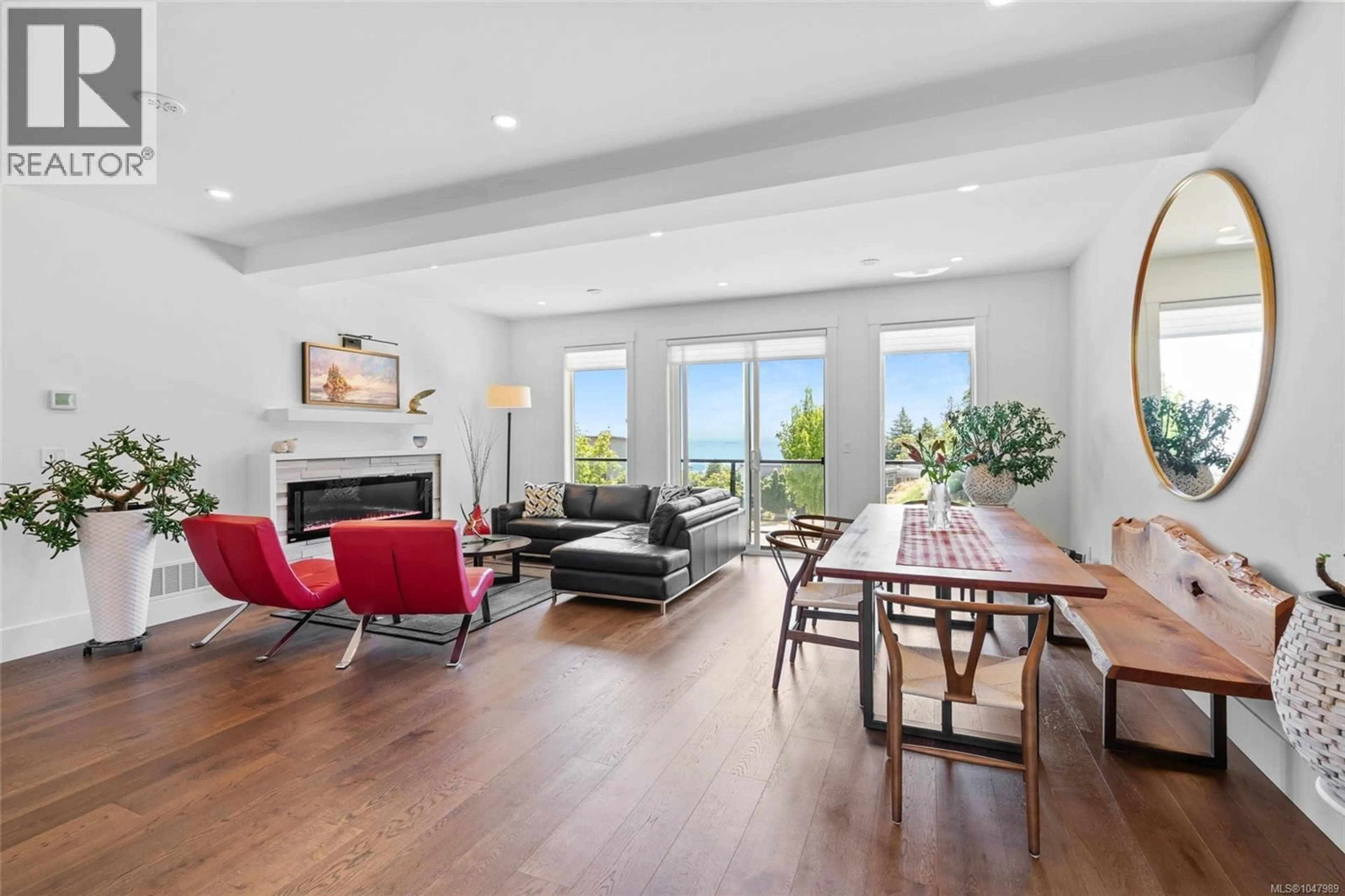Living room with furniture, wood/laminate floor for 119 - 539 DELORA DRIVE, Colwood British Columbia V9C0M2