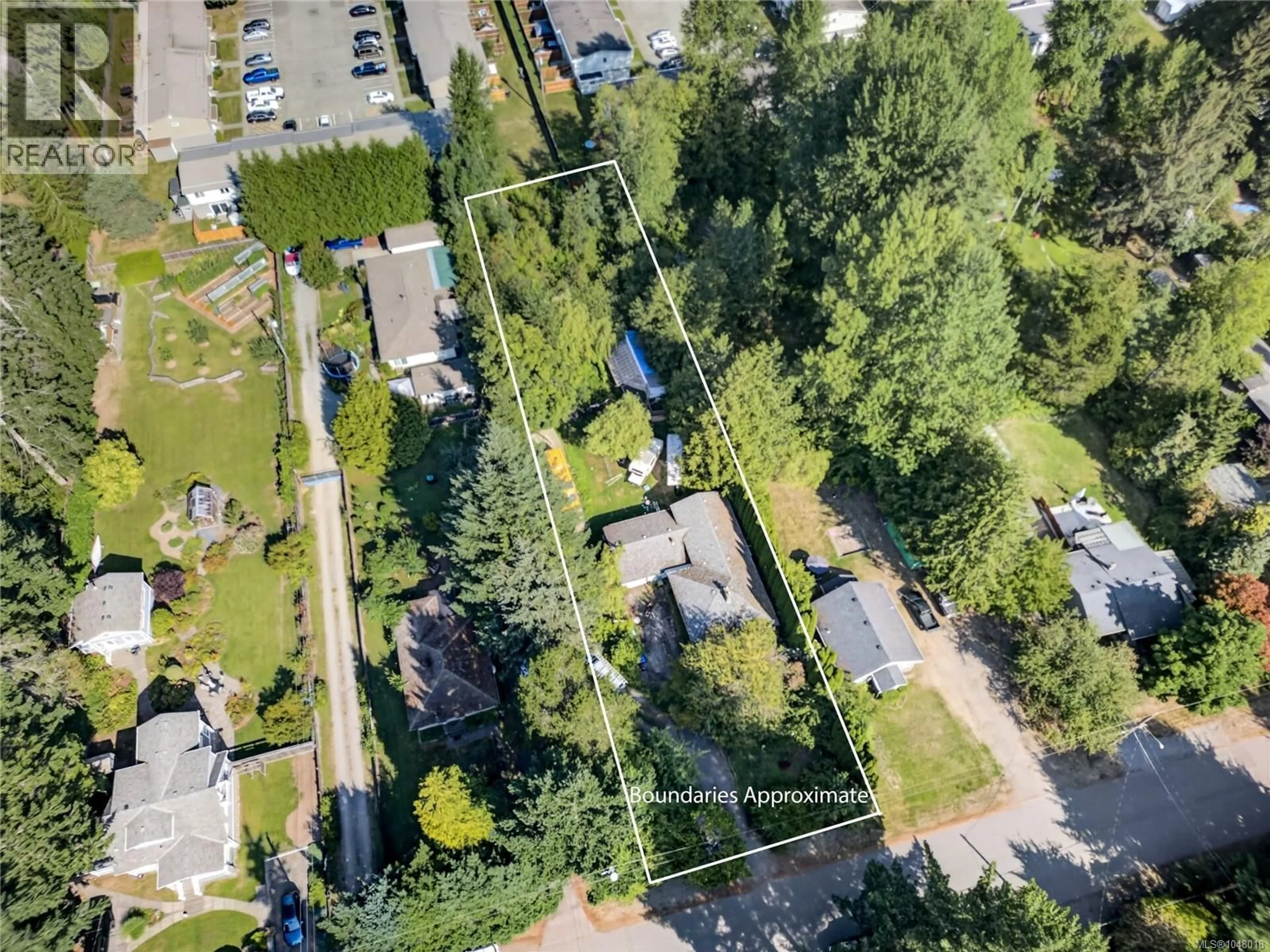 A pic from outside/outdoor area/front of a property/back of a property/a pic from drone, forest/trees view for 1655 15TH STREET, Courtenay British Columbia V9N2C3