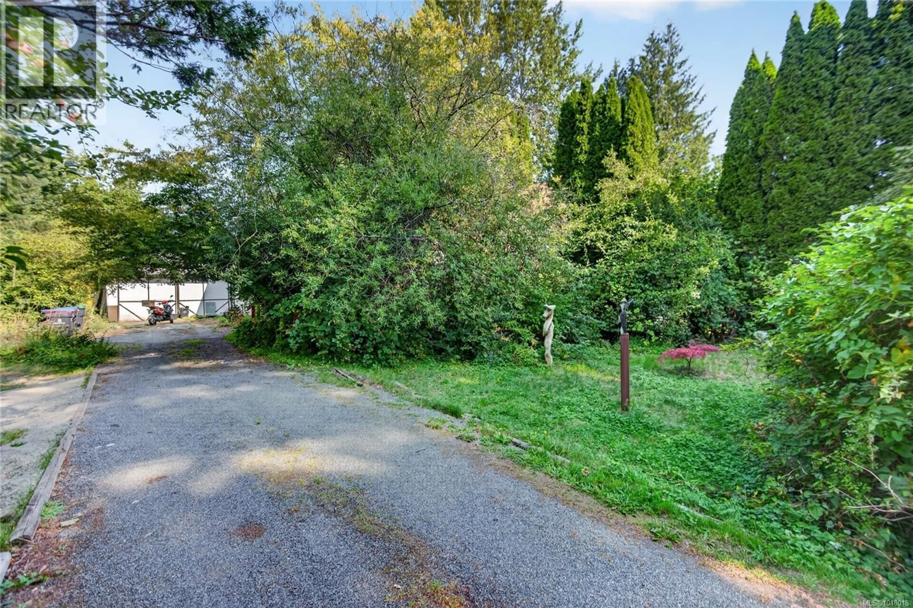 A pic from outside/outdoor area/front of a property/back of a property/a pic from drone, forest/trees view for 1655 15TH STREET, Courtenay British Columbia V9N2C3