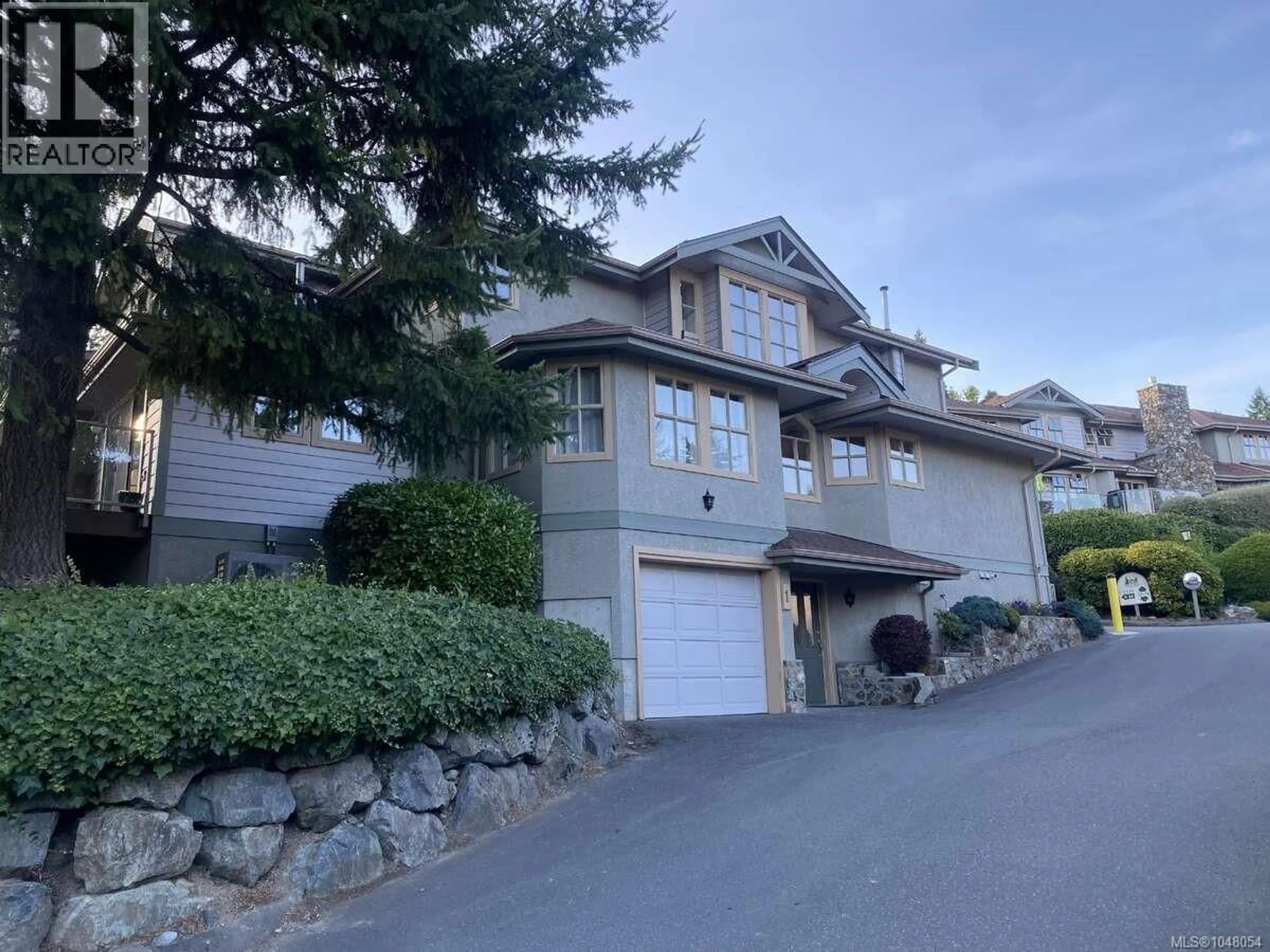 A pic from outside/outdoor area/front of a property/back of a property/a pic from drone, street for 1 - 500 MARSETT PLACE, Saanich British Columbia V8Z7J1
