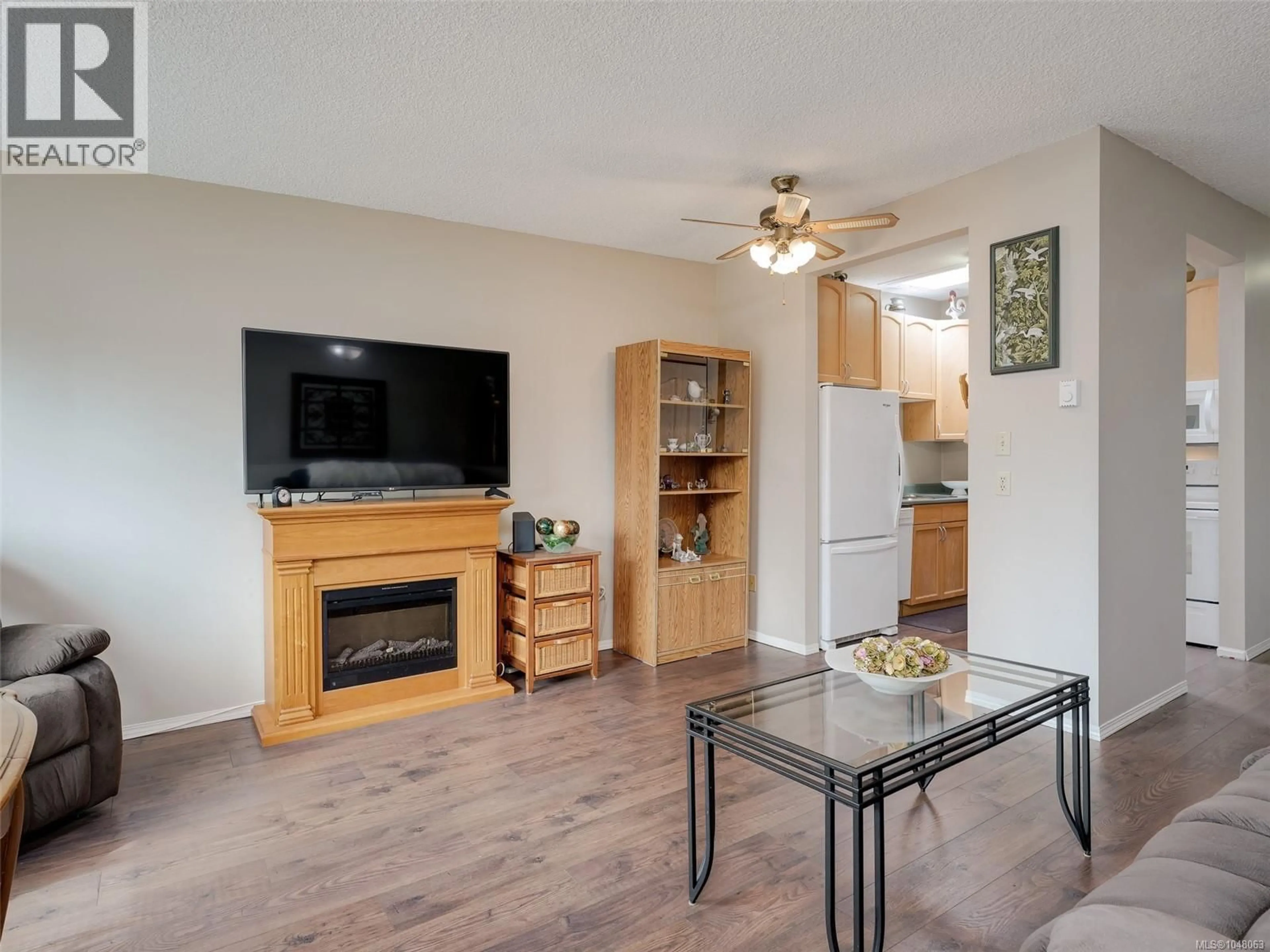 Living room with furniture, wood/laminate floor for 303 - 642 ADMIRALS ROAD, Esquimalt British Columbia V9A2N7