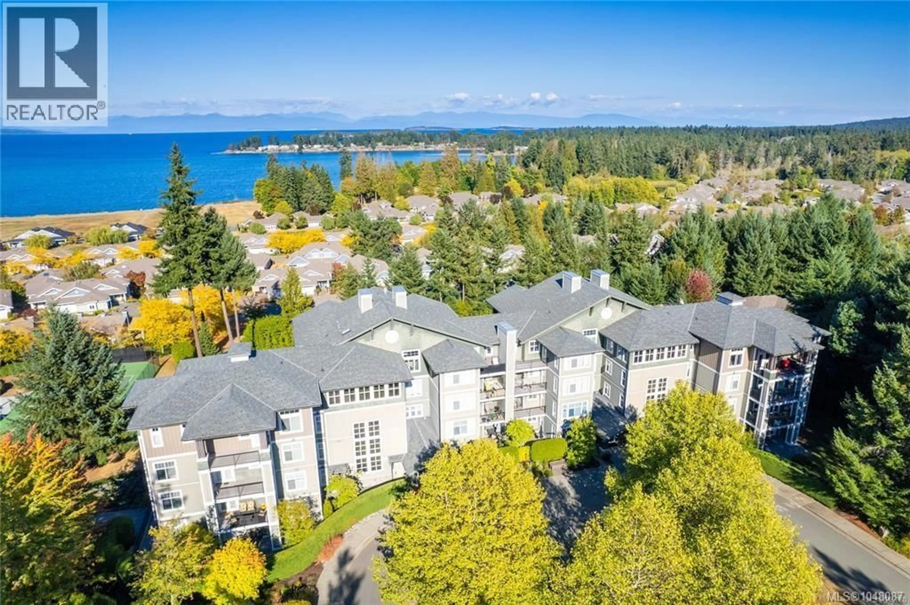 A pic from outside/outdoor area/front of a property/back of a property/a pic from drone, water/lake/river/ocean view for 204A - 1325 CAPE COD DRIVE, Parksville British Columbia V9P2Y8