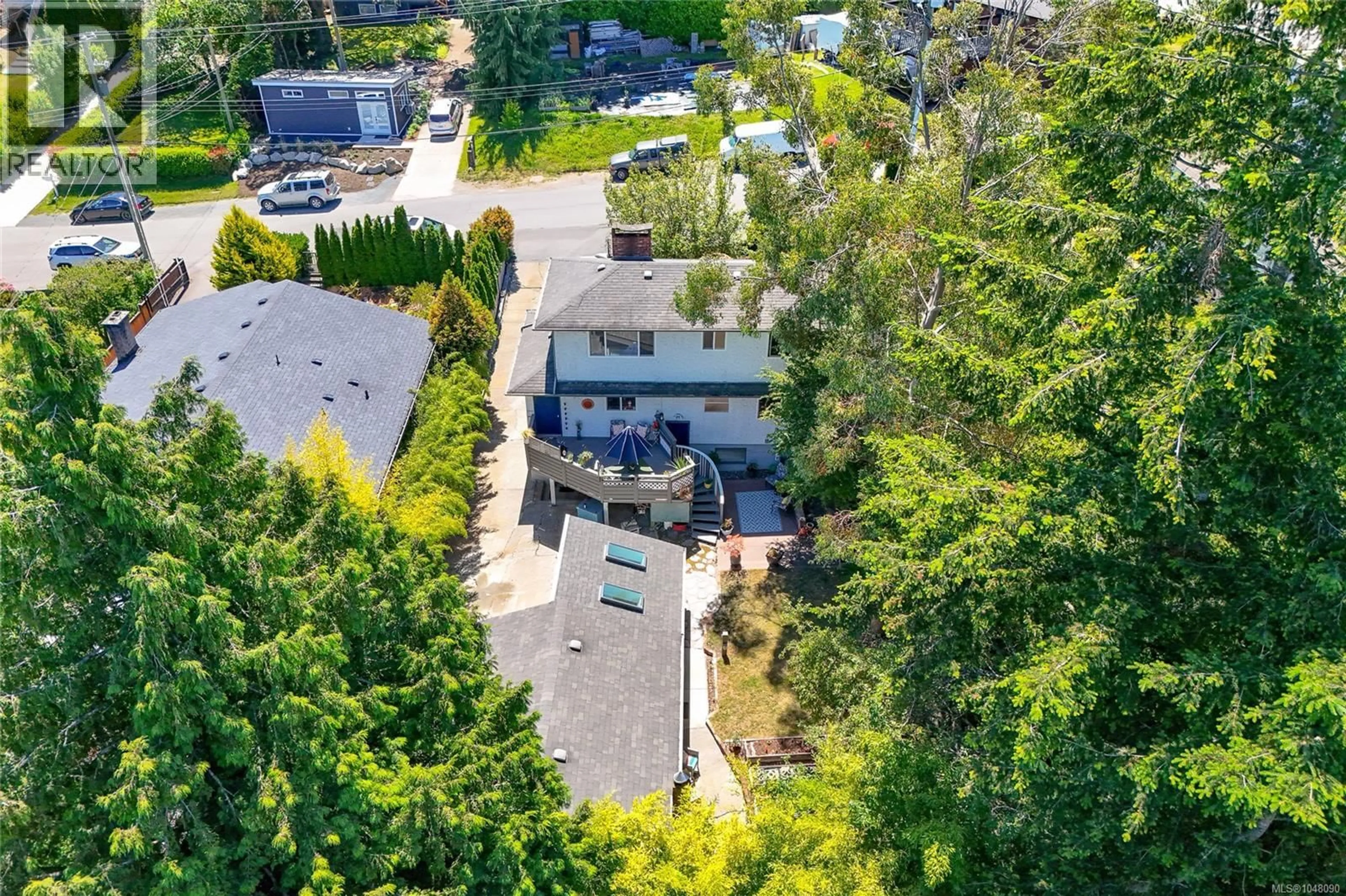 A pic from outside/outdoor area/front of a property/back of a property/a pic from drone, street for 610 KENT ROAD, Saanich British Columbia V8Z1Z1