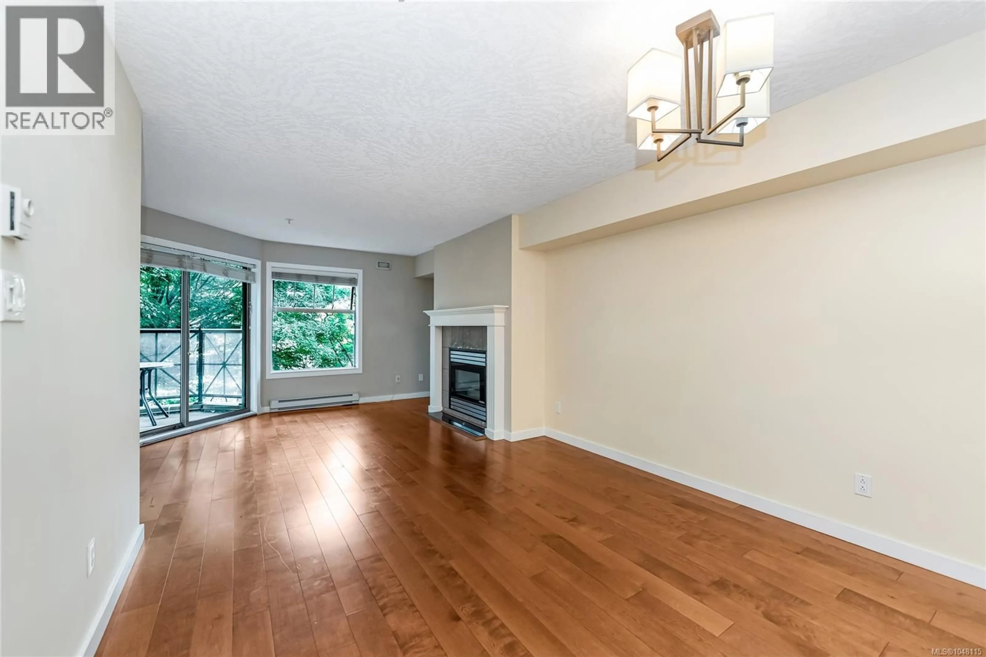 Living room with furniture, wood/laminate floor for 209 - 935 JOHNSON STREET, Victoria British Columbia V8V3N5