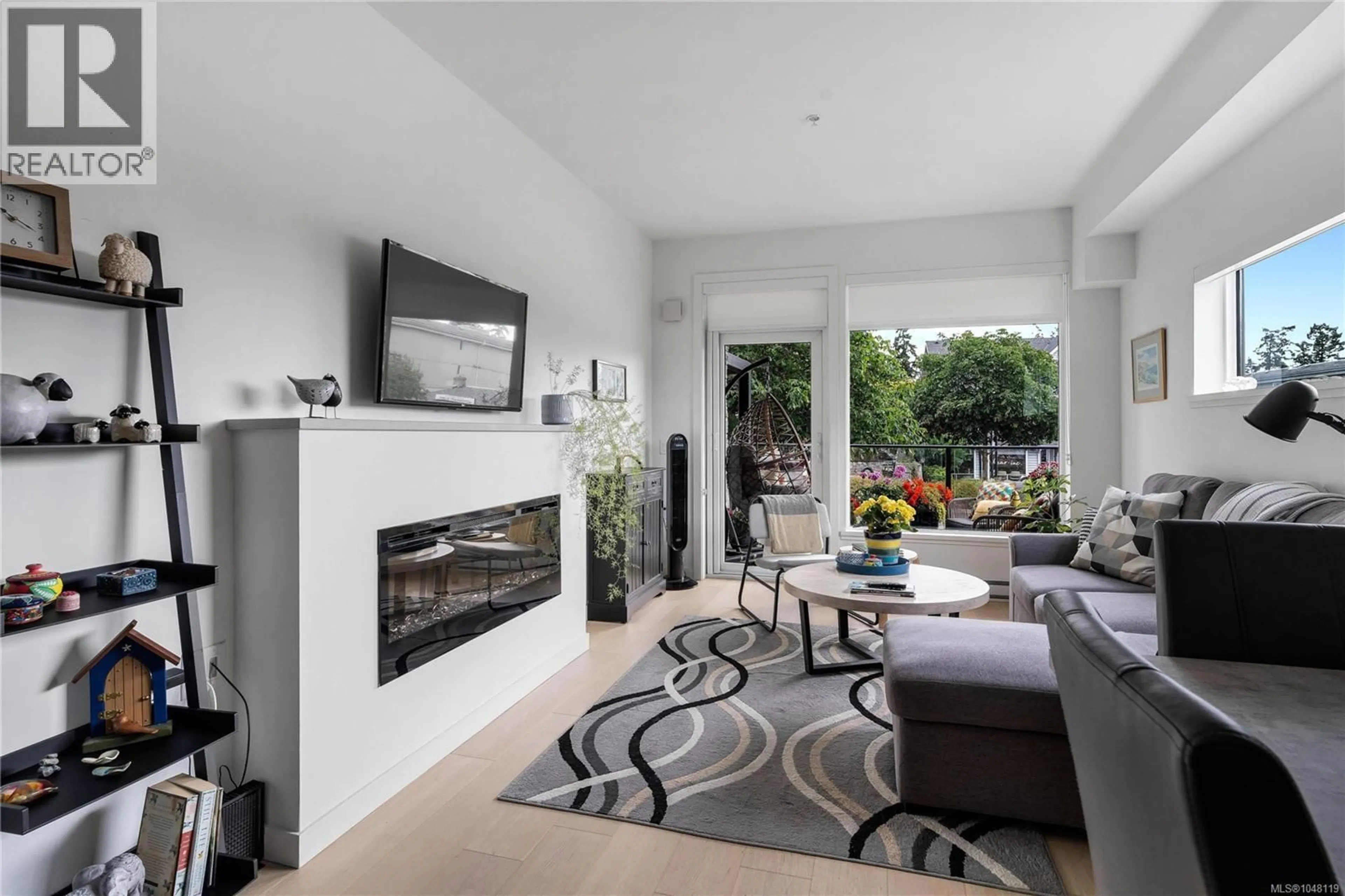 Living room with furniture, unknown for 201 - 7162 WEST SAANICH ROAD, Central Saanich British Columbia V8M1P6