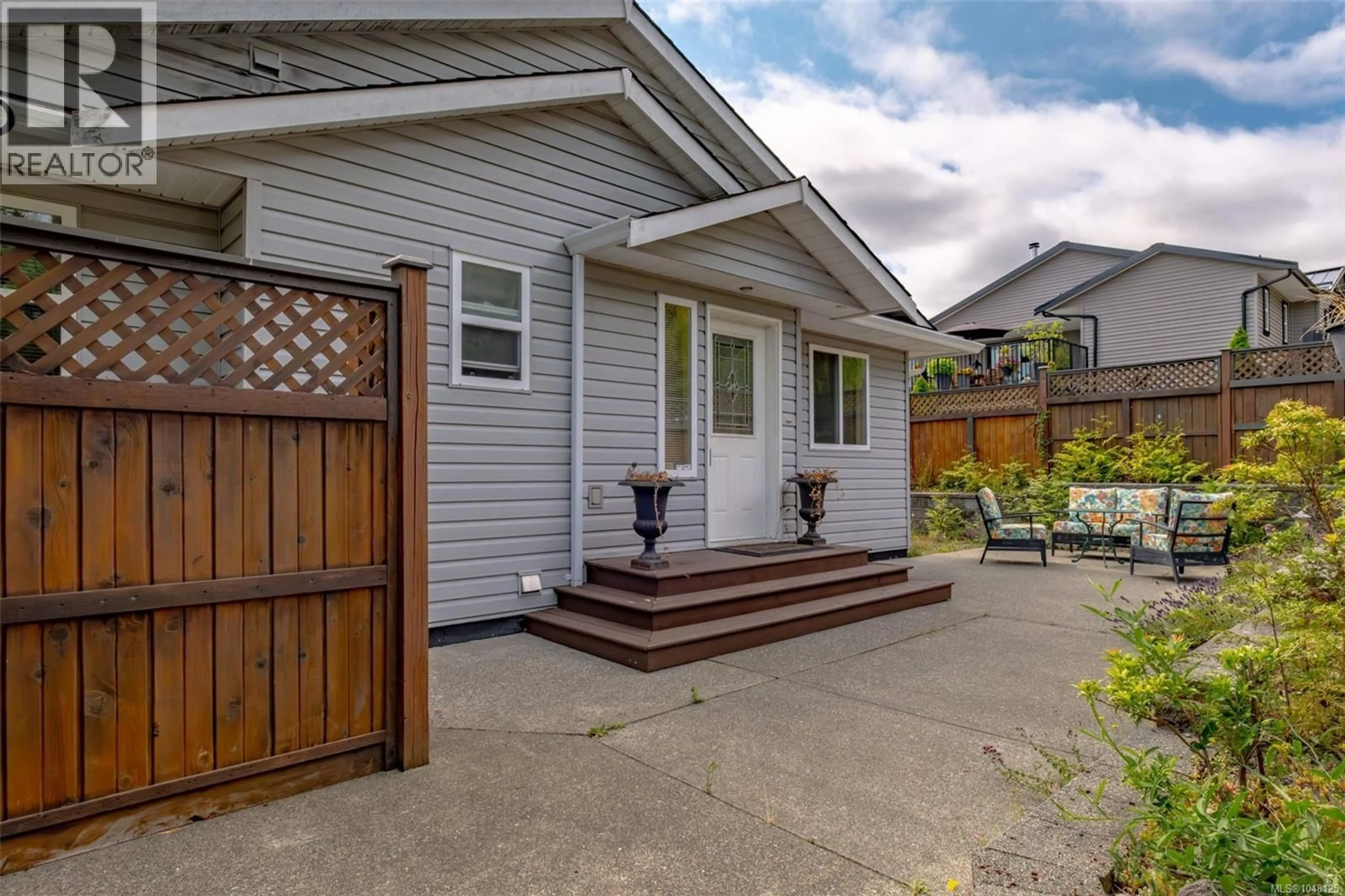 Home with vinyl exterior material, street for 1731 DAR'S PLACE, Qualicum Beach British Columbia V9K2S3