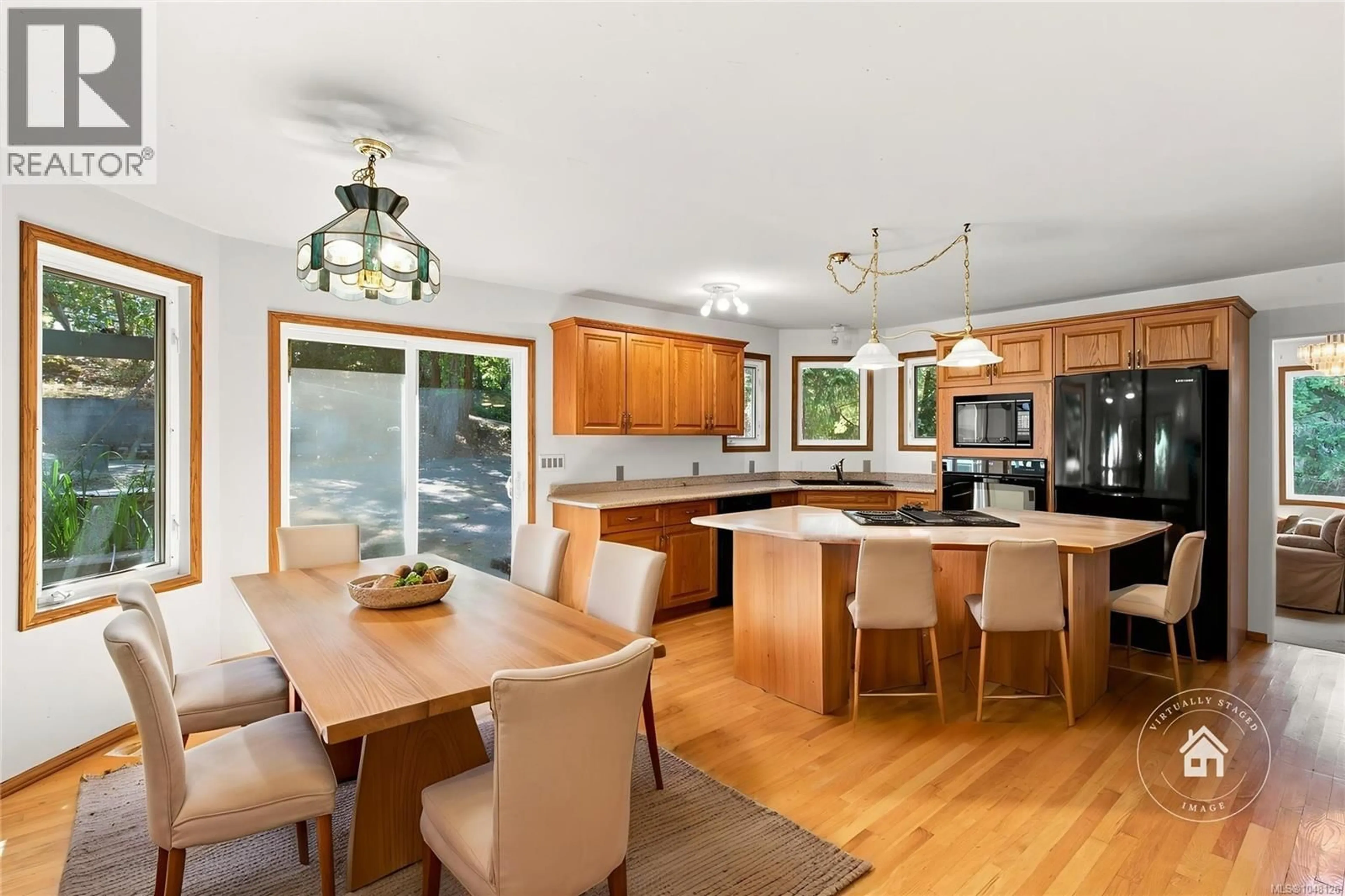 Open concept kitchen, wood/laminate floor for 945 LITTLE MOUNTAIN ROAD, Parksville British Columbia V9P2C3