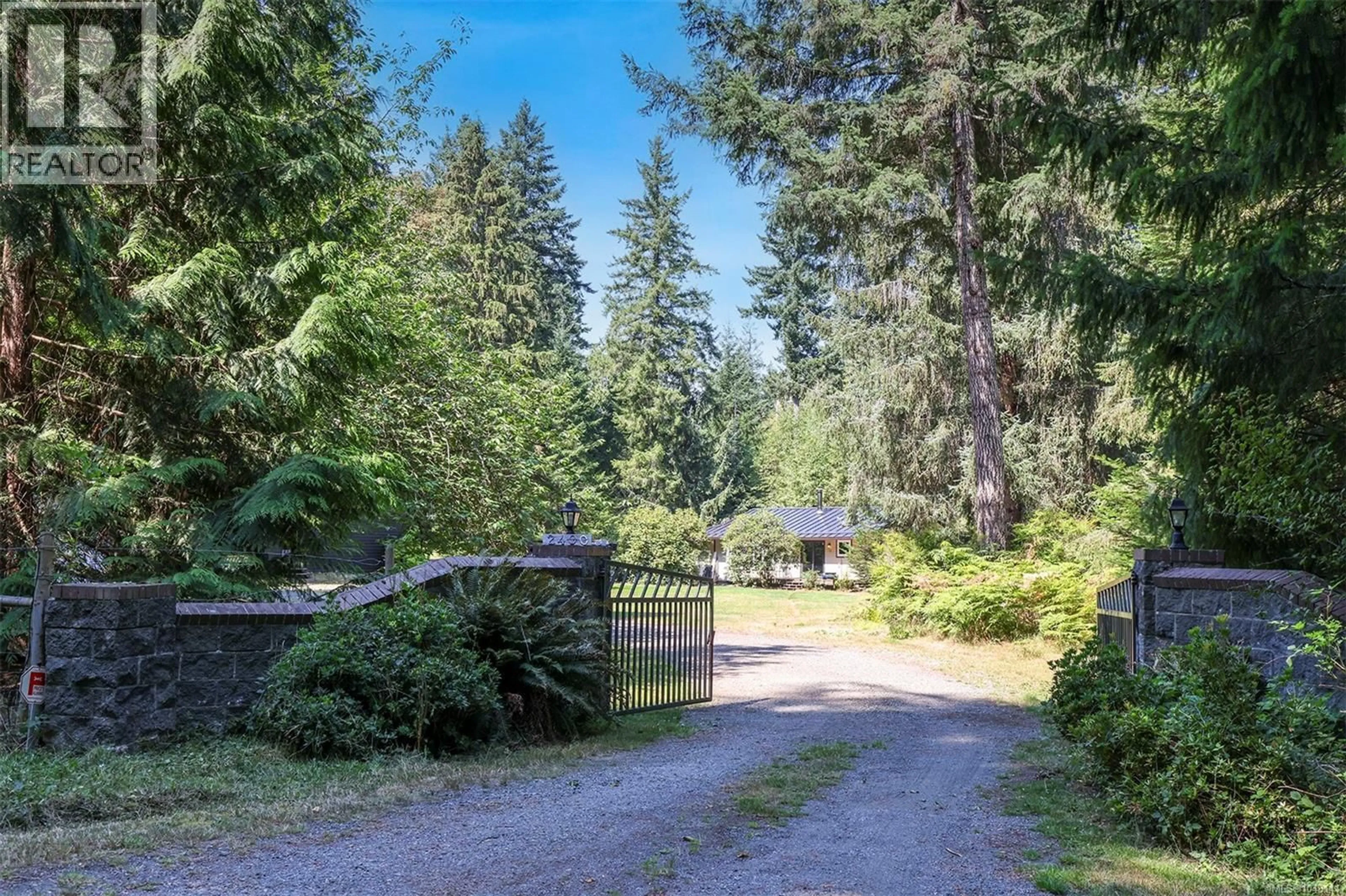 A pic from outside/outdoor area/front of a property/back of a property/a pic from drone, forest/trees view for 2400 CLARK ROAD, Courtenay British Columbia V9J1T1