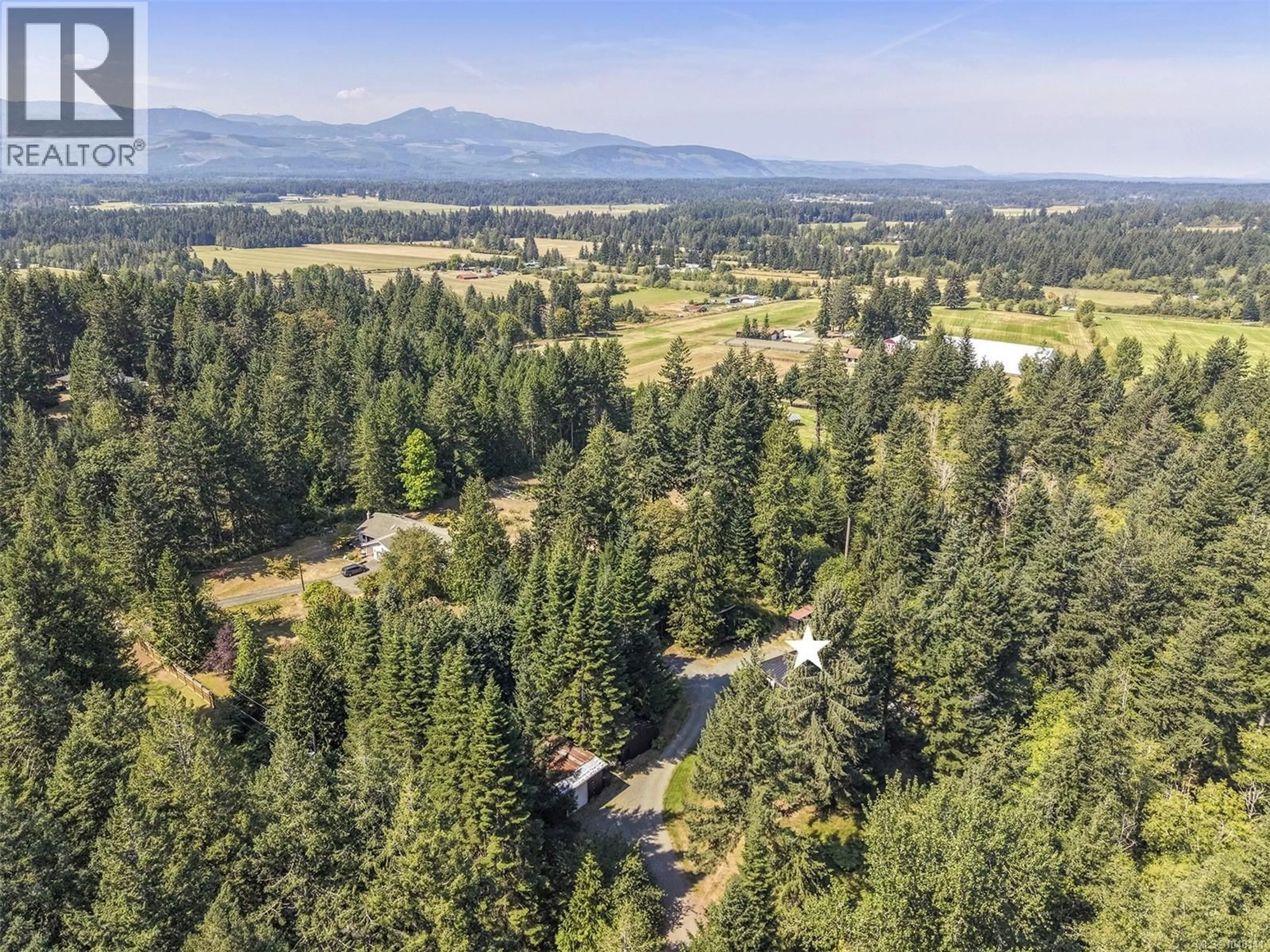A pic from outside/outdoor area/front of a property/back of a property/a pic from drone, forest/trees view for 2400 CLARK ROAD, Courtenay British Columbia V9J1T1