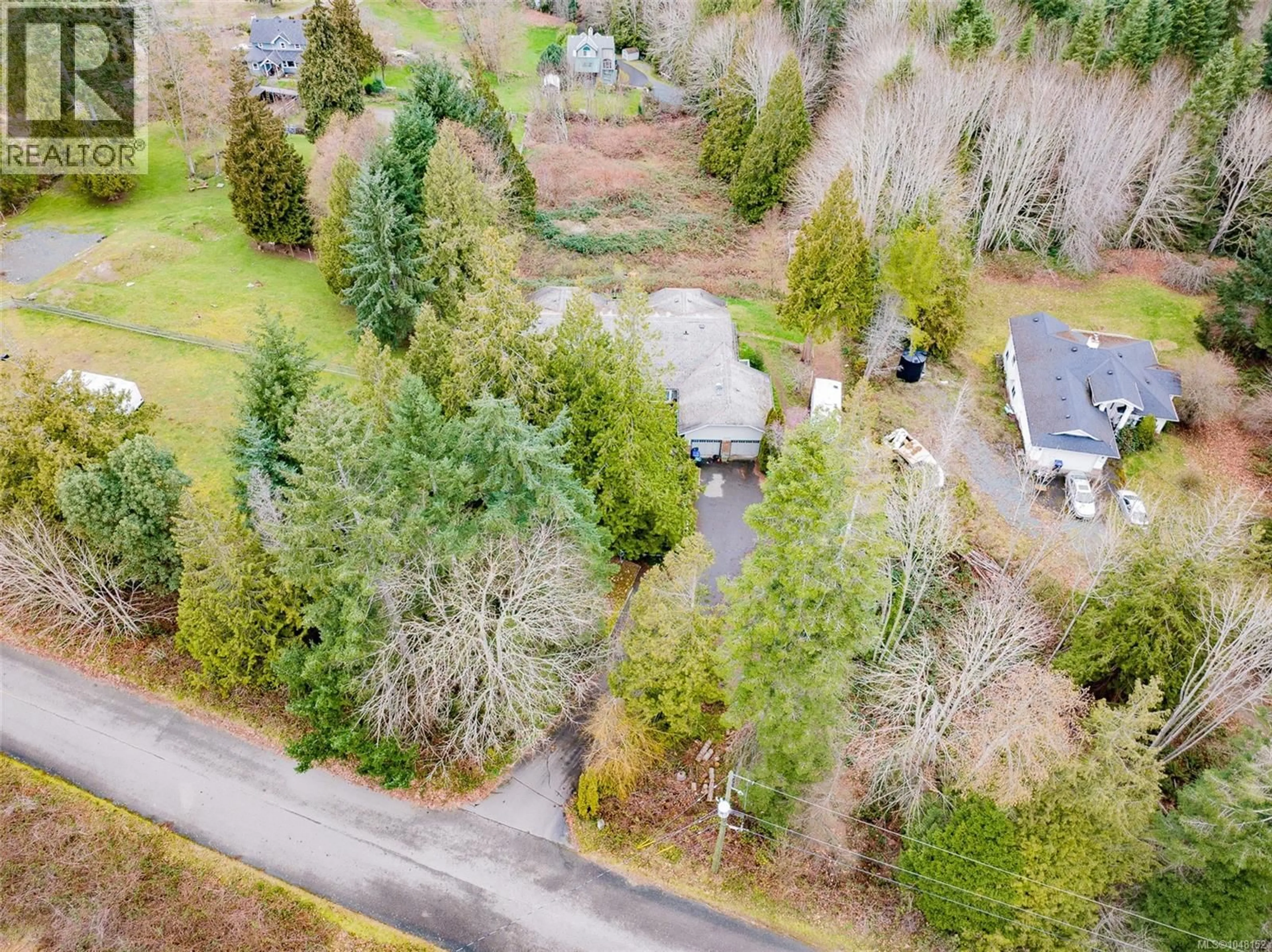 A pic from outside/outdoor area/front of a property/back of a property/a pic from drone, forest/trees view for 7810 AATS ROAD, Lantzville British Columbia V0R2H0