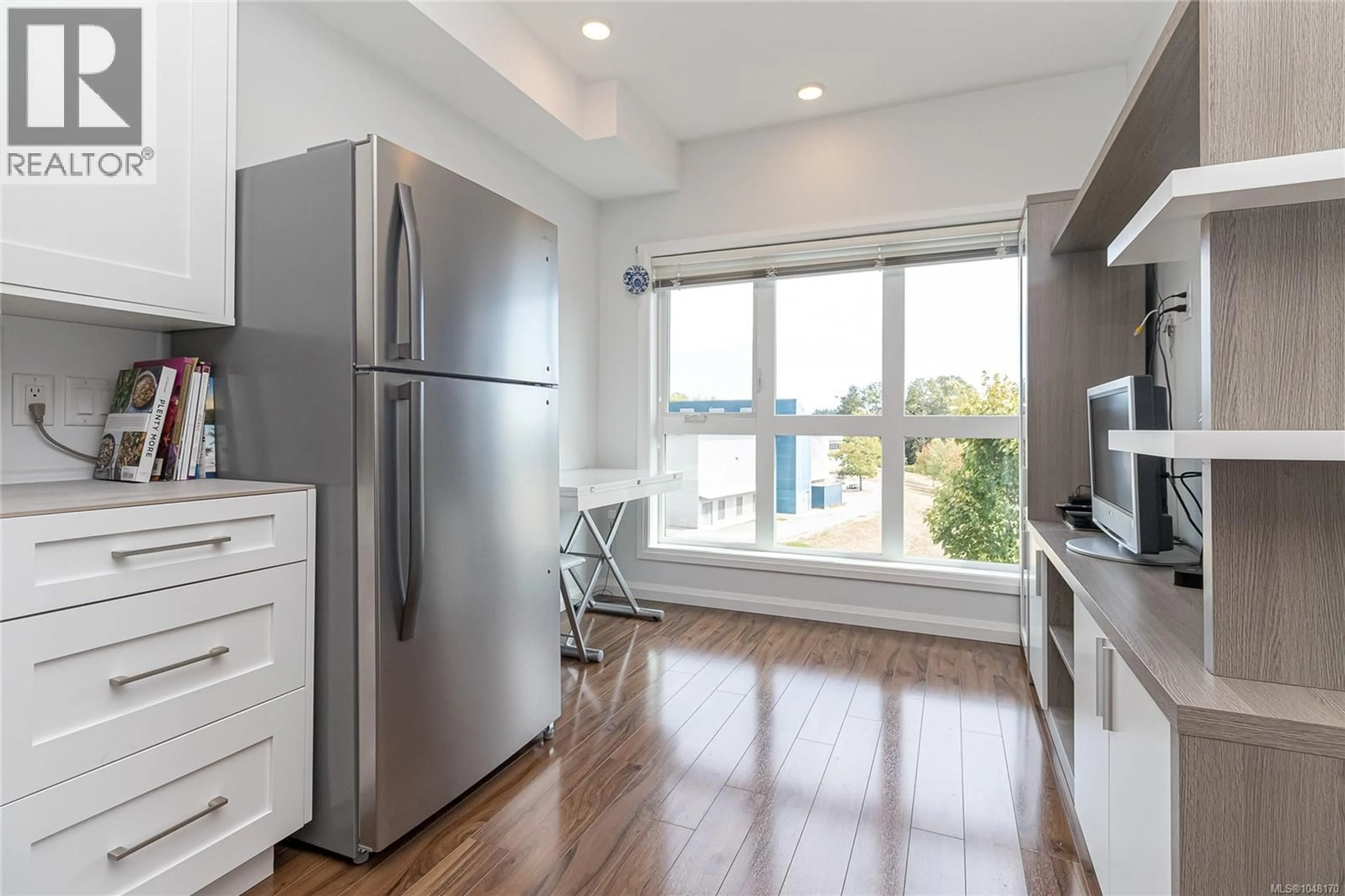Open concept kitchen, wood/laminate floor for 304 - 745 TRAVINO LANE, Saanich British Columbia V8Z0E5
