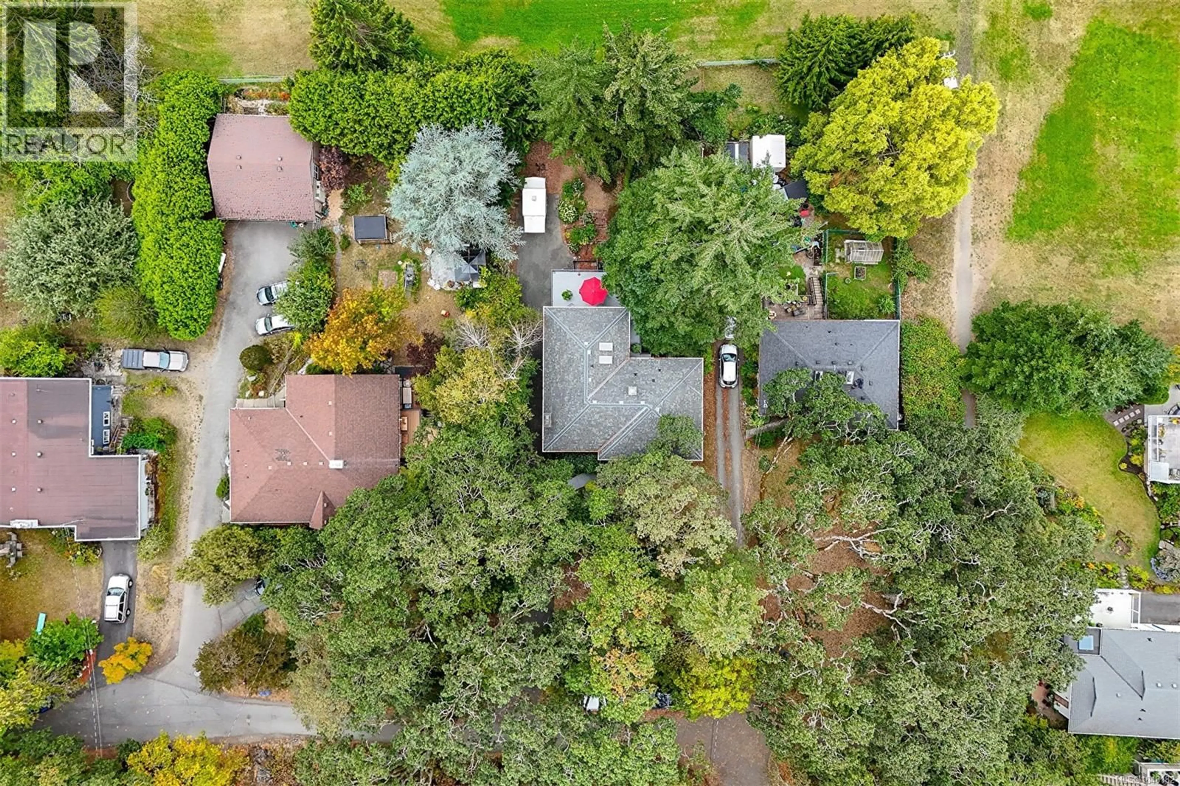 A pic from outside/outdoor area/front of a property/back of a property/a pic from drone, forest/trees view for 3960 CUMBERLAND ROAD, Saanich British Columbia V8P3J8