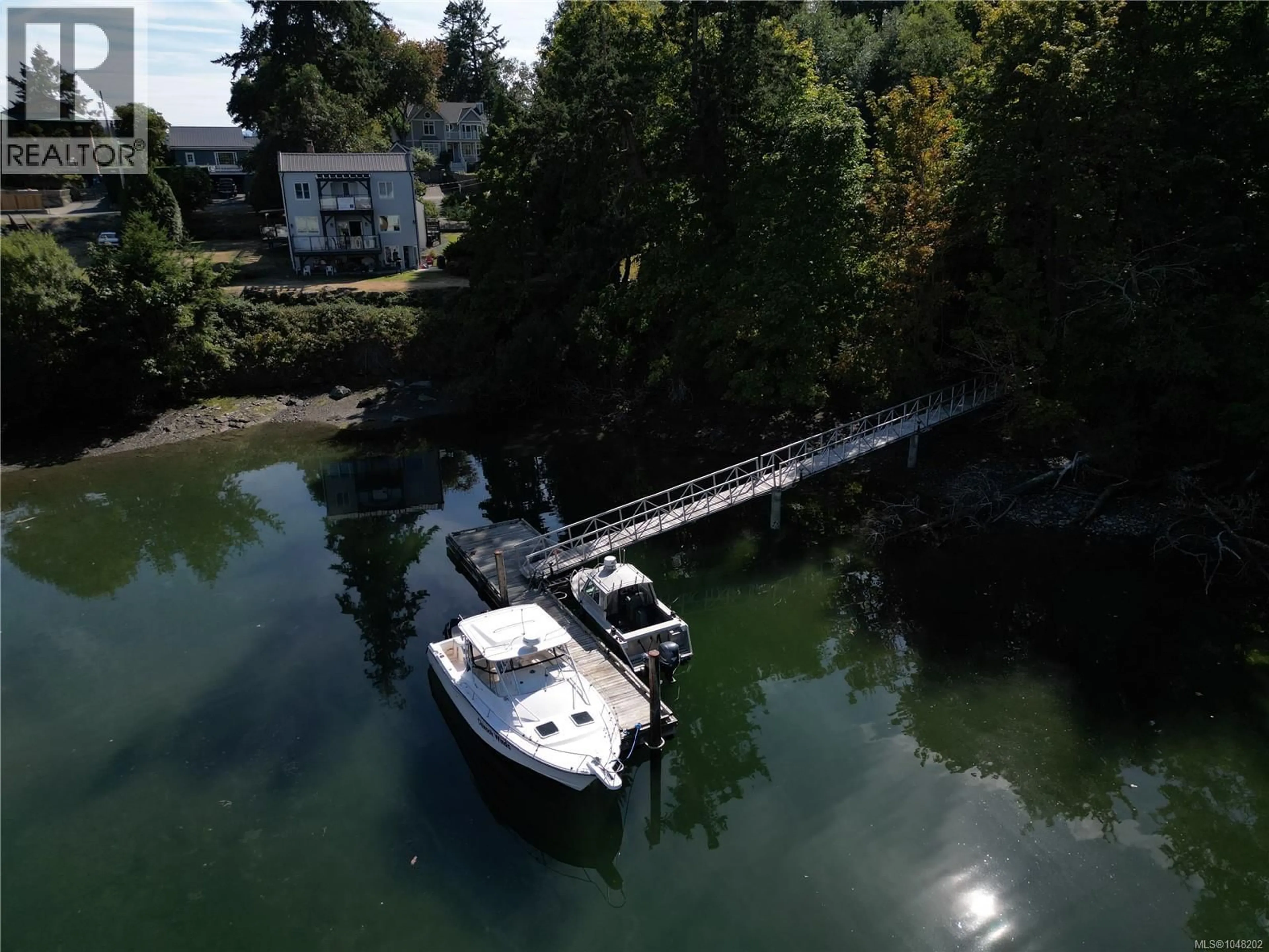 A pic from outside/outdoor area/front of a property/back of a property/a pic from drone, water/lake/river/ocean view for 5025 GENOA BAY ROAD, Duncan British Columbia V9L5Y6