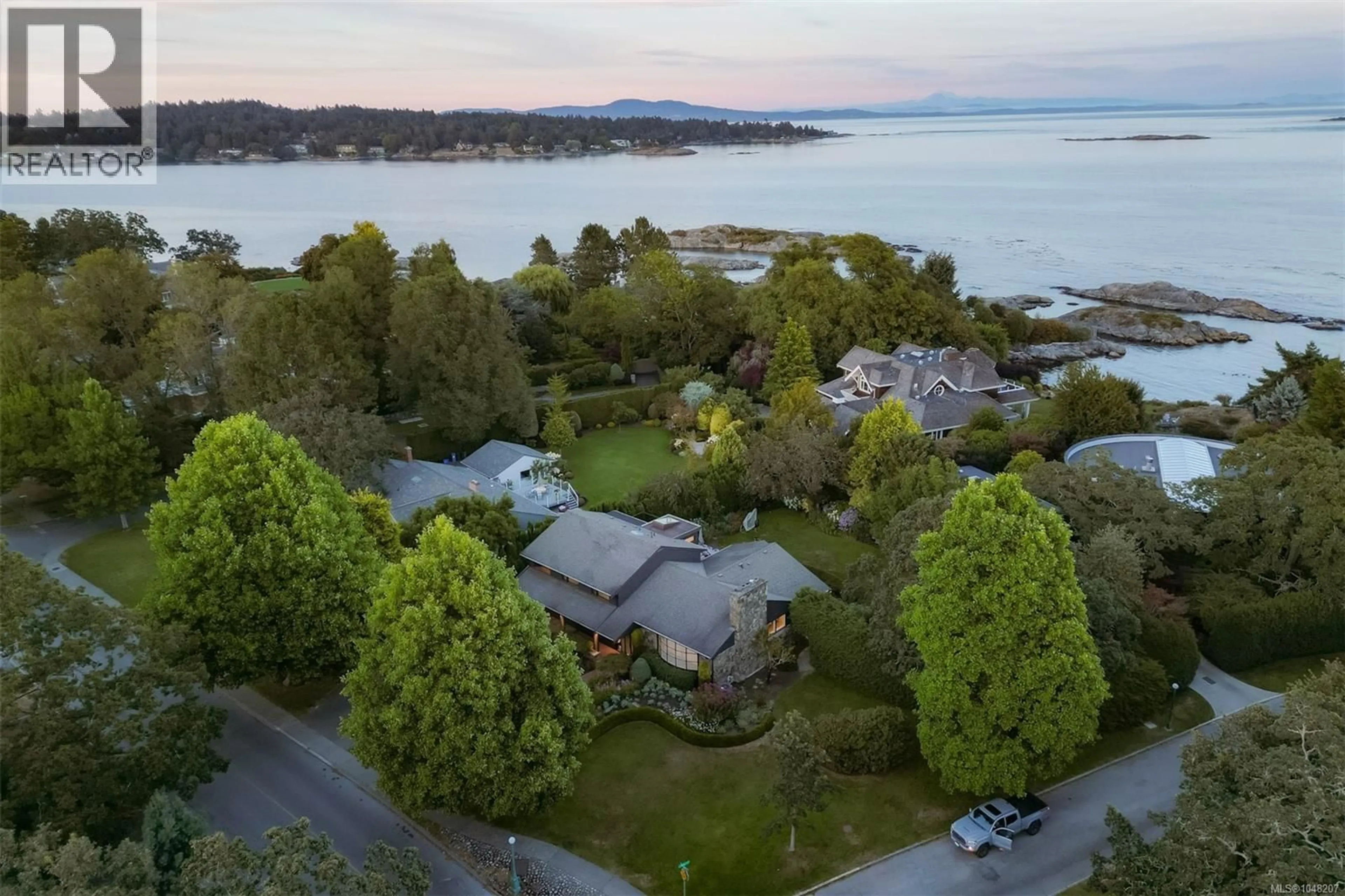 A pic from outside/outdoor area/front of a property/back of a property/a pic from drone, water/lake/river/ocean view for 3055 BEACH DRIVE, Oak Bay British Columbia V8R6L5