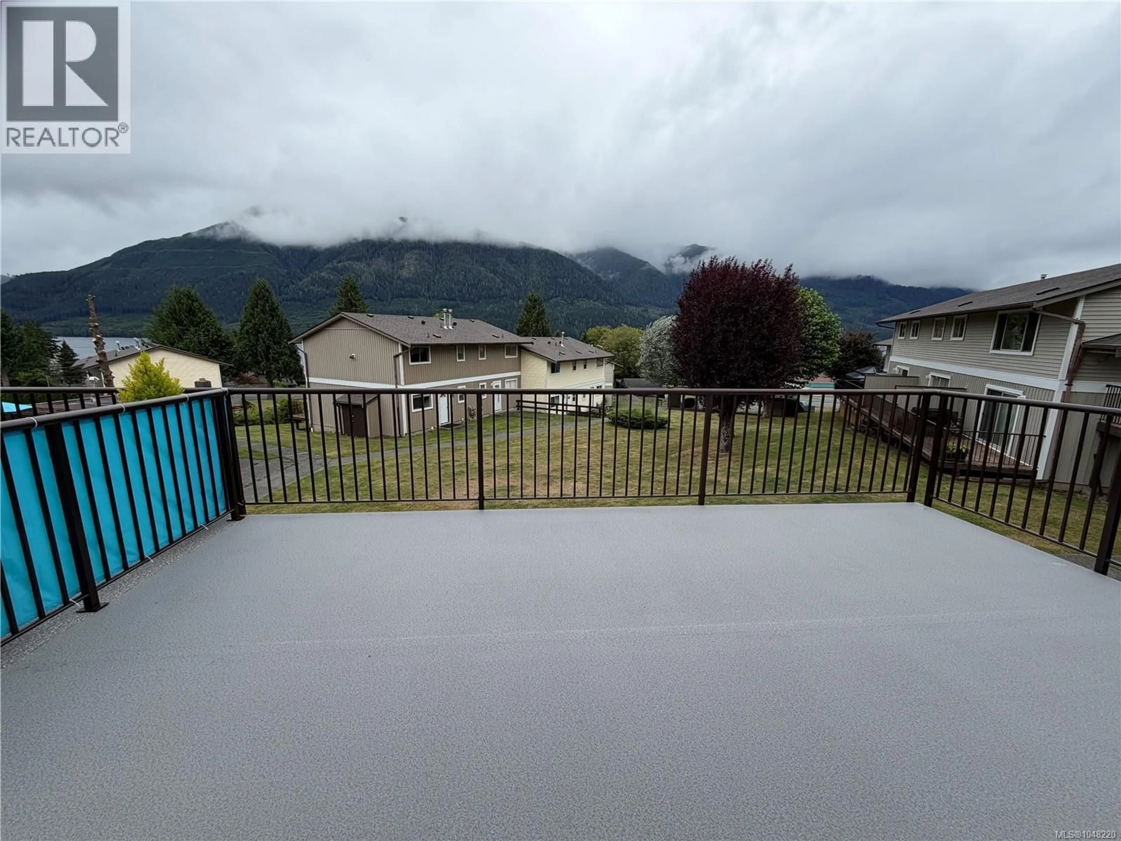 A pic from outside/outdoor area/front of a property/back of a property/a pic from drone, mountain view for 404 HAIDA AVENUE, Port Alice British Columbia V0N2N0