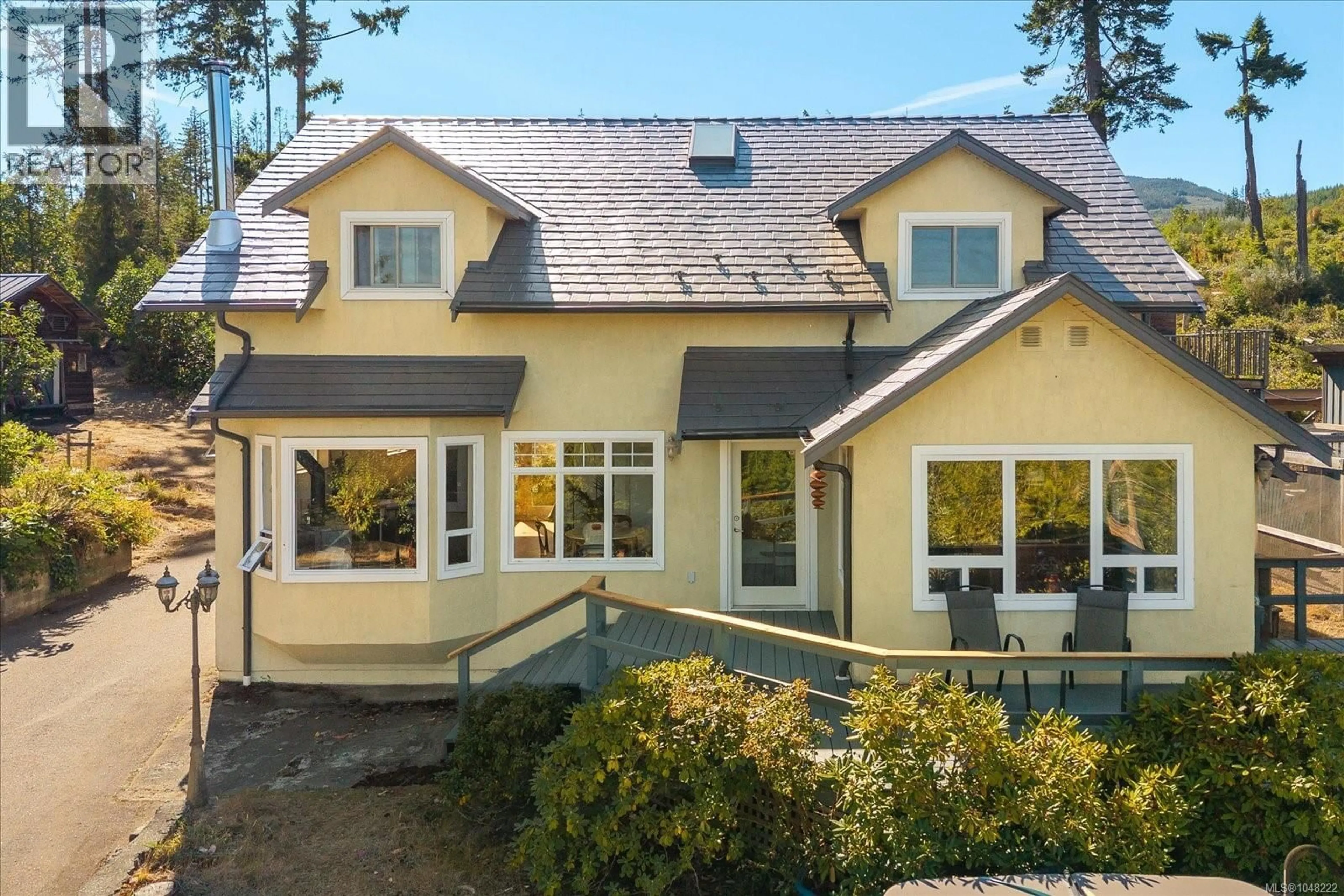 Home with vinyl exterior material, street for 1040 KOEN ROAD, Qualicum Beach British Columbia V9K1V4