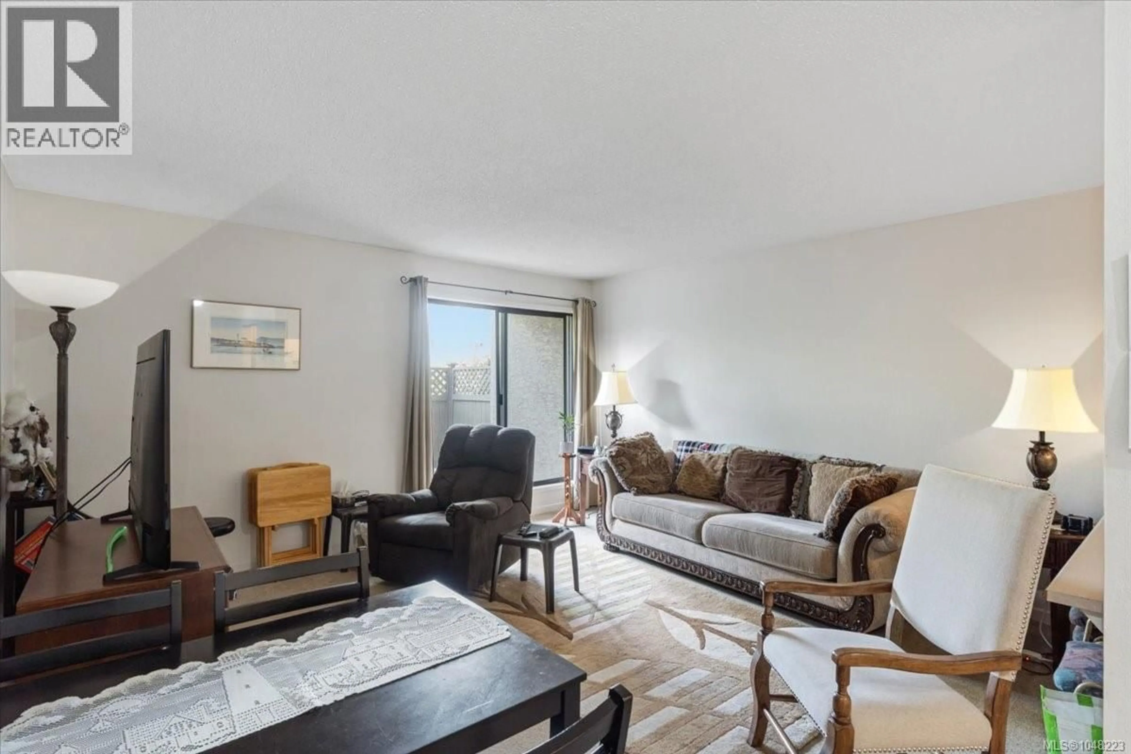 Living room with furniture, wood/laminate floor for 101 - 345 MORISON AVENUE, Parksville British Columbia V9P1P6