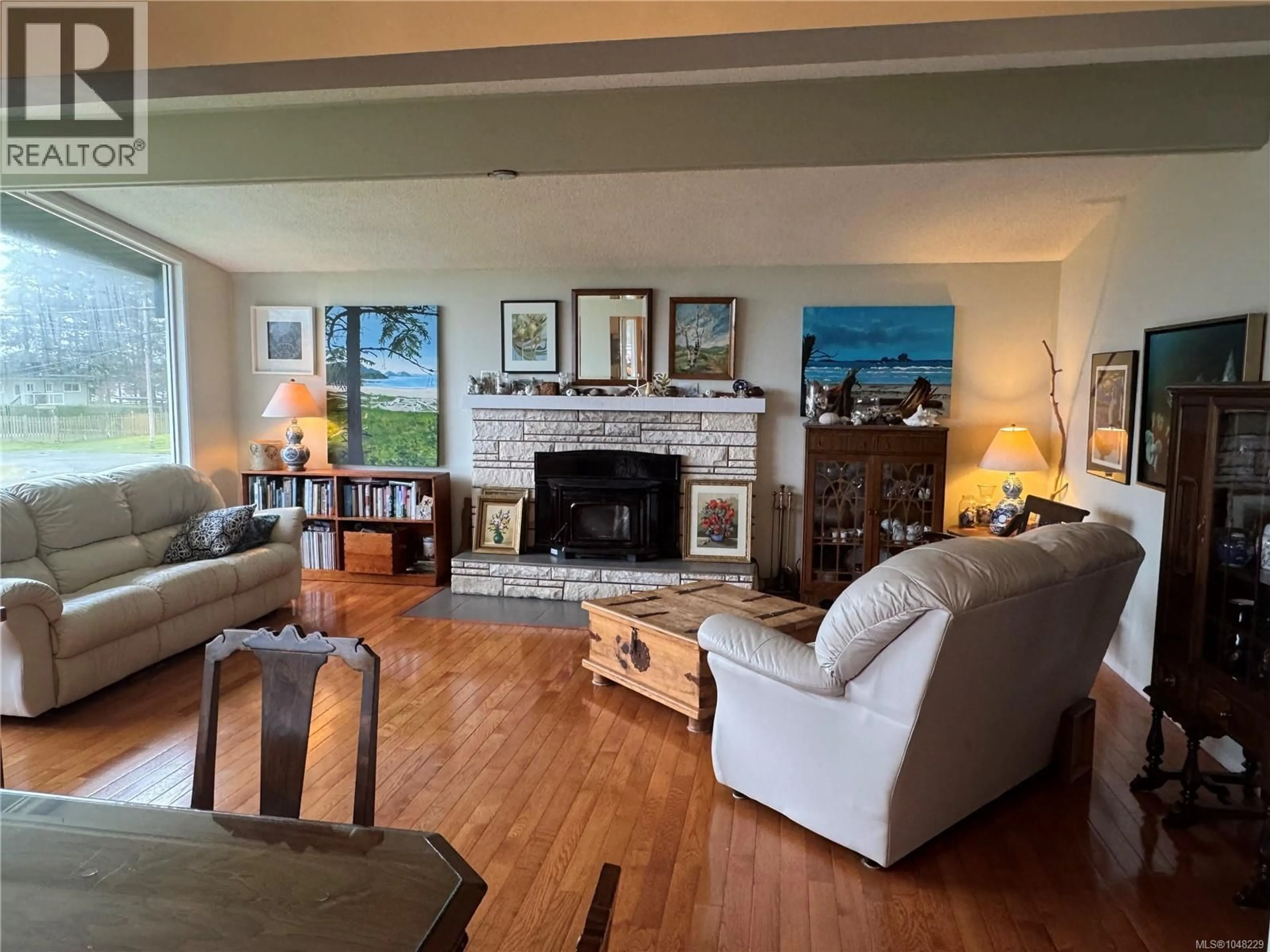 Living room with furniture, wood/laminate floor for 6420 CHATHAM AVENUE, Port Hardy British Columbia V0N2P0