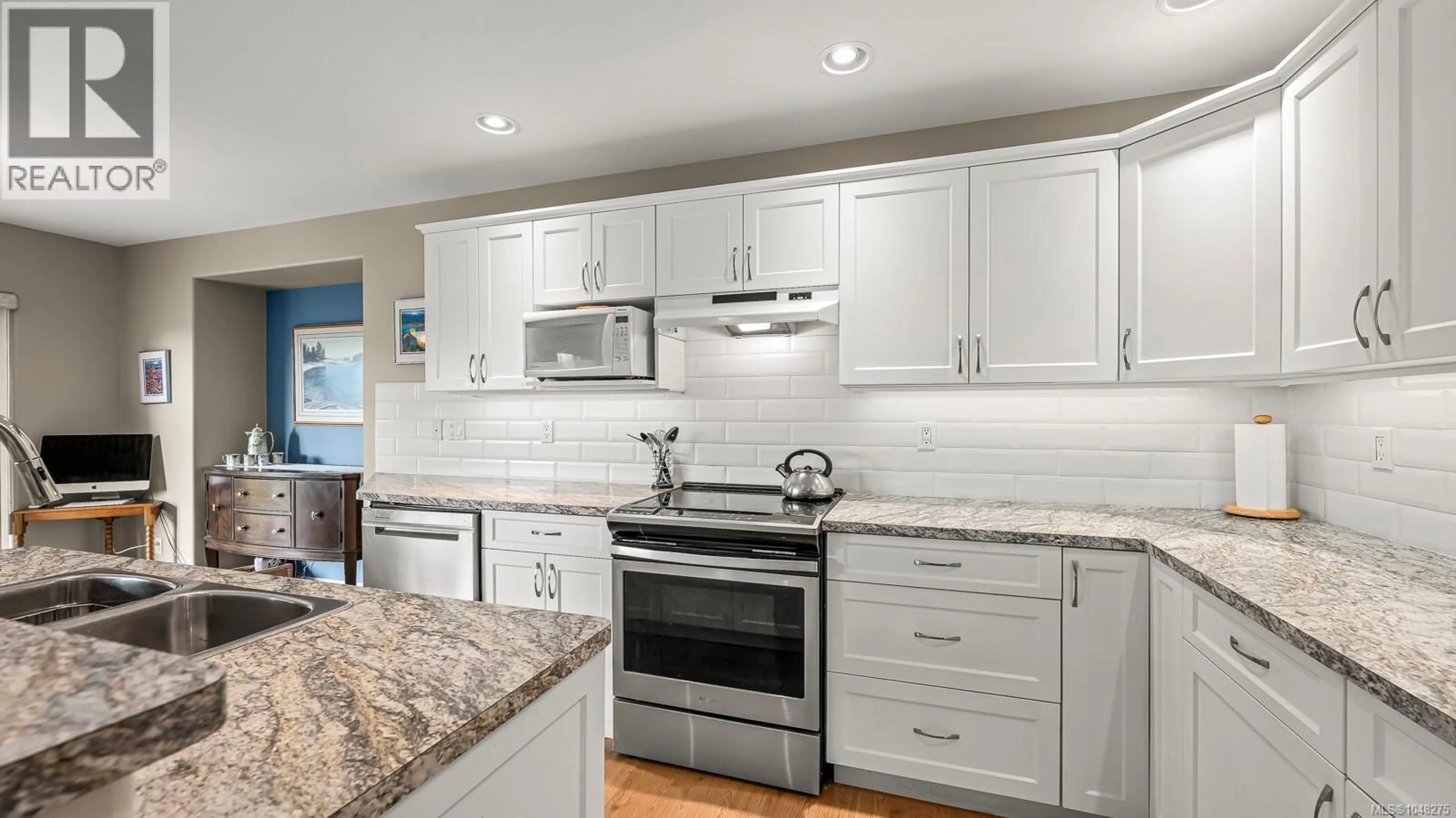 Open concept kitchen, ceramic/tile floor for 2435 IDIENS WAY, Courtenay British Columbia V9N9J3