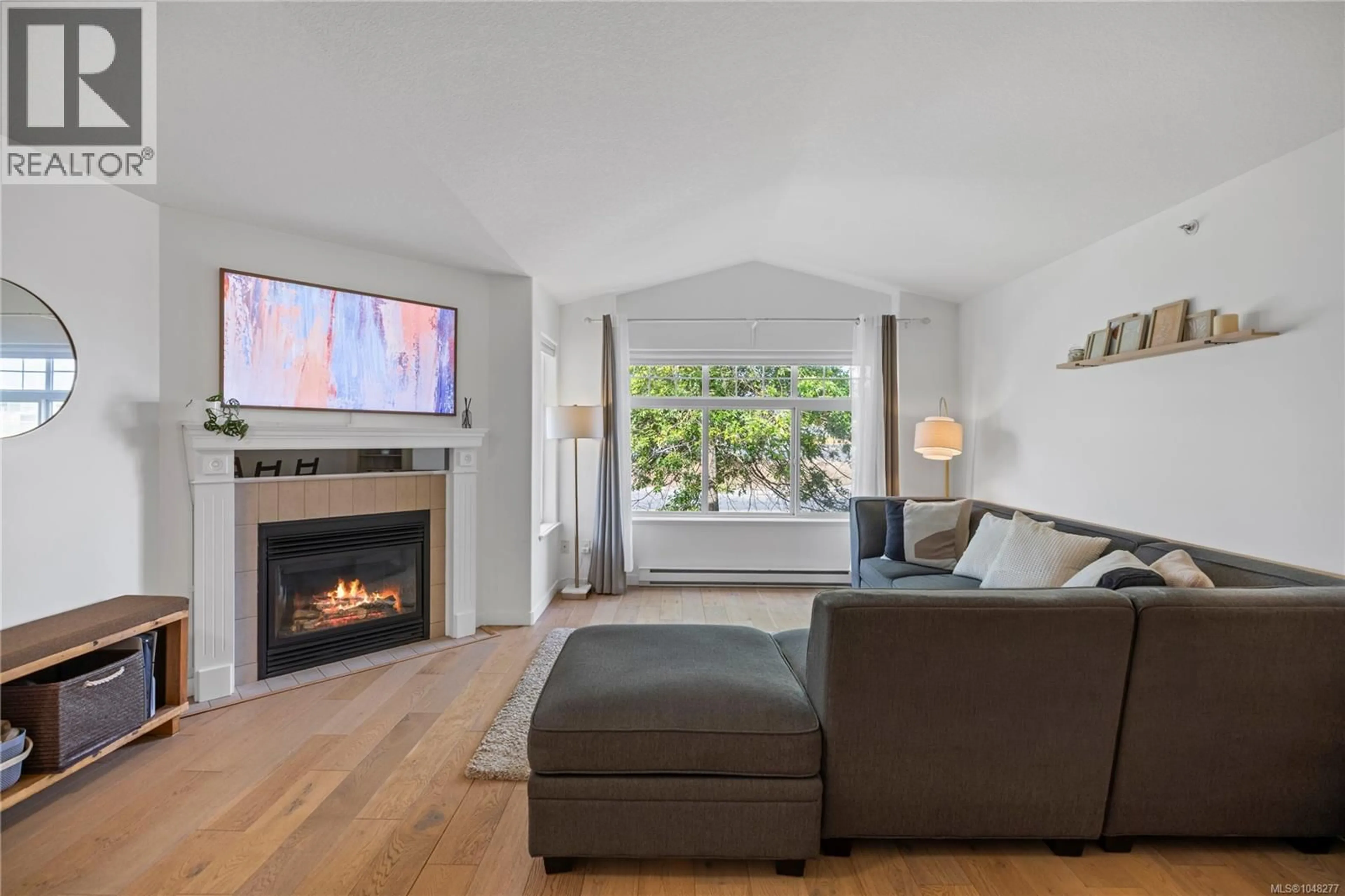 Living room with furniture, wood/laminate floor for 6140B MCGIRR ROAD, Nanaimo British Columbia V9V1V1