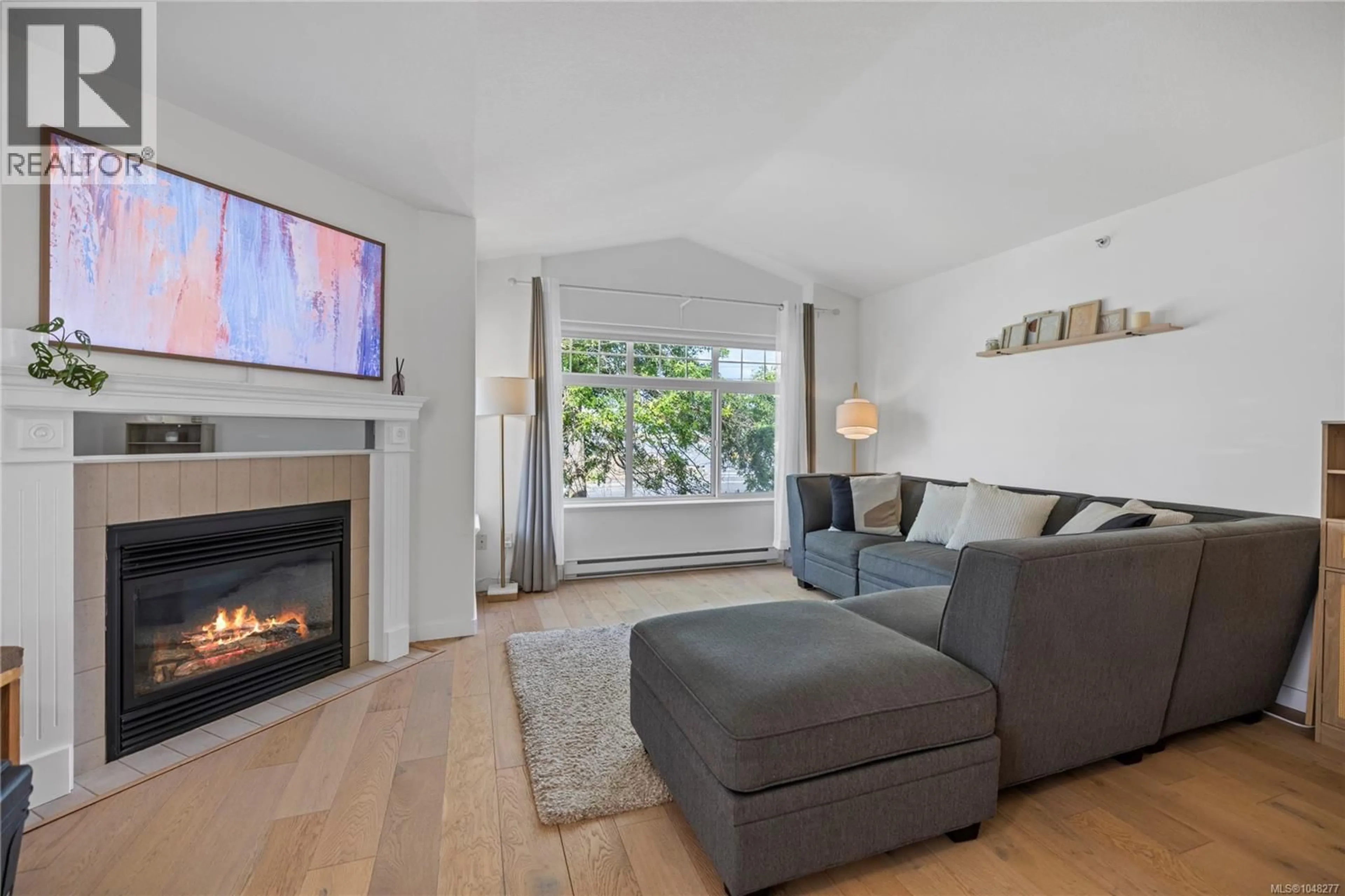 Living room with furniture, wood/laminate floor for 6140B MCGIRR ROAD, Nanaimo British Columbia V9V1V1