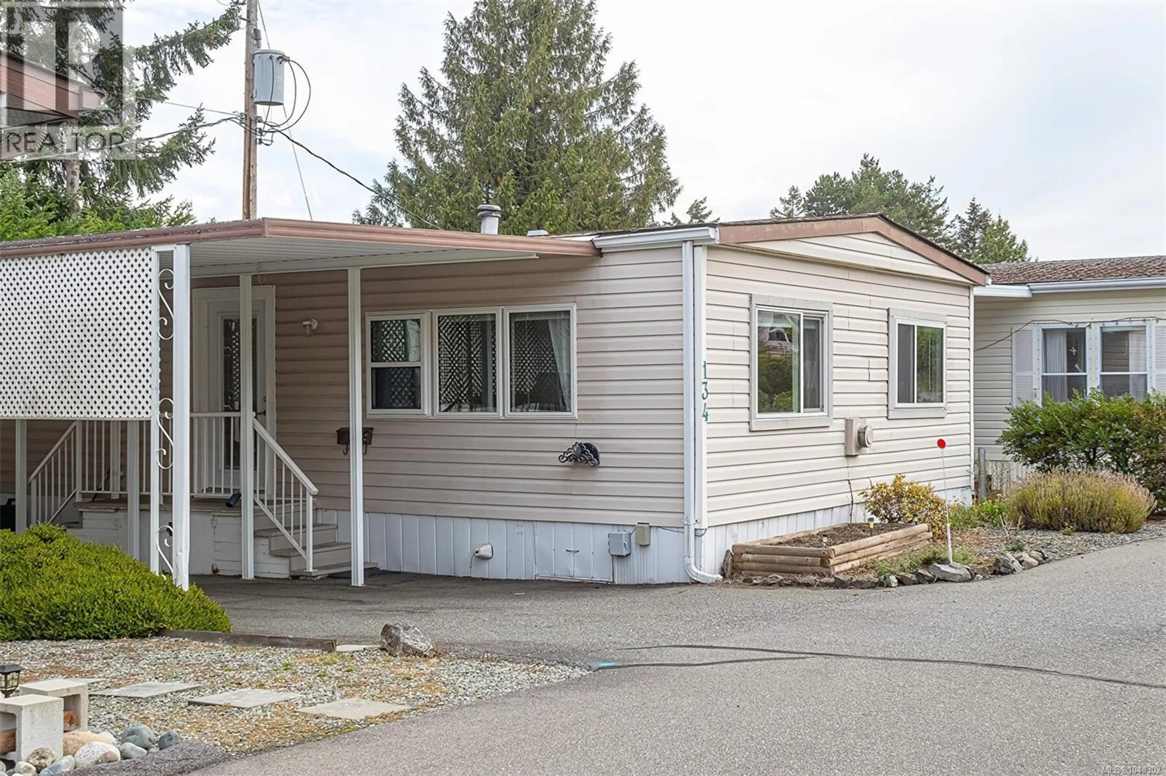 Home with vinyl exterior material, street for 134 - 6325 METRAL DRIVE SOUTH, Nanaimo British Columbia V9T6P9