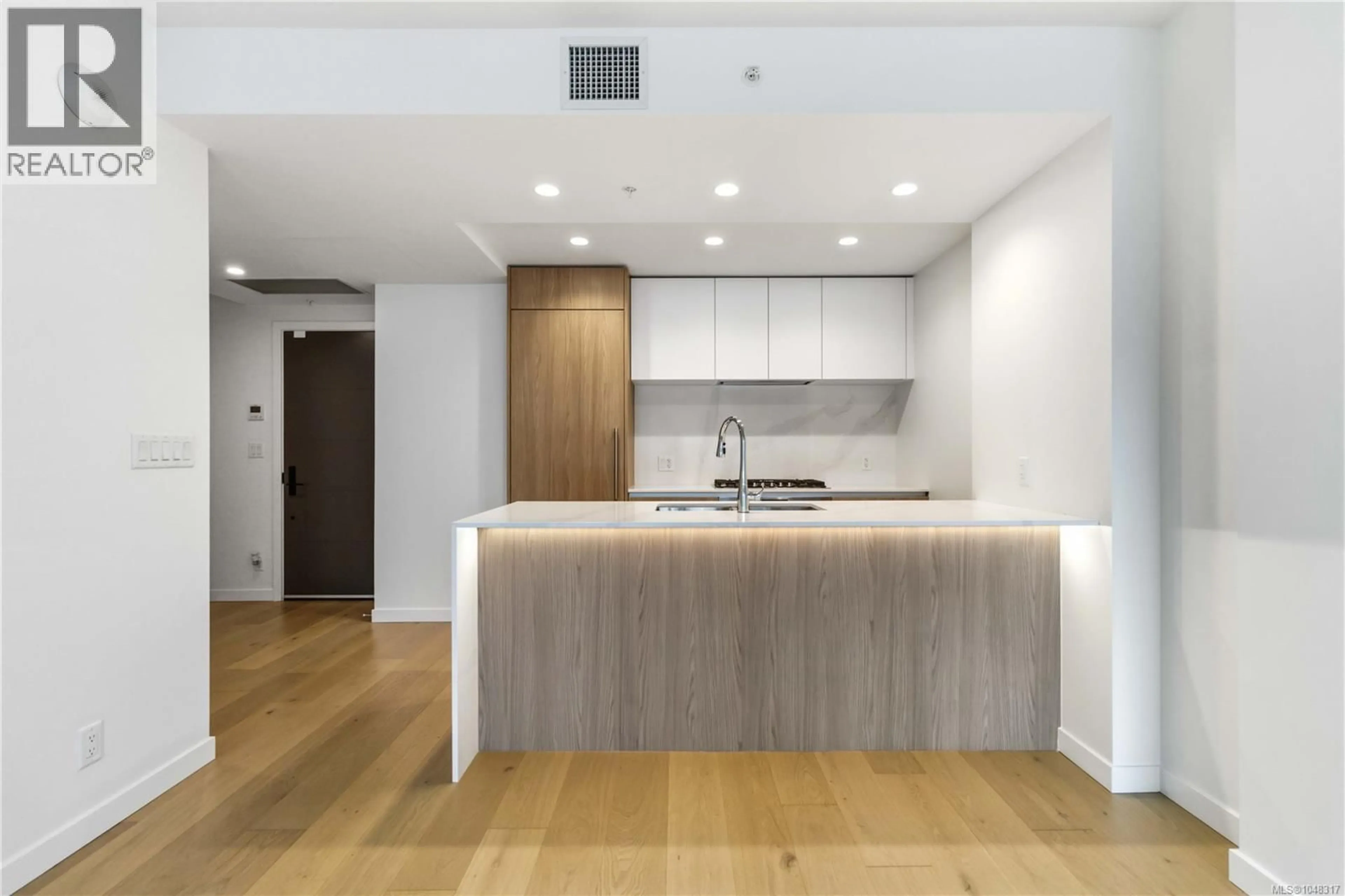 Open concept kitchen, wood/laminate floor for 1013 - 2000 HANNINGTON ROAD, Langford British Columbia V9B7C1