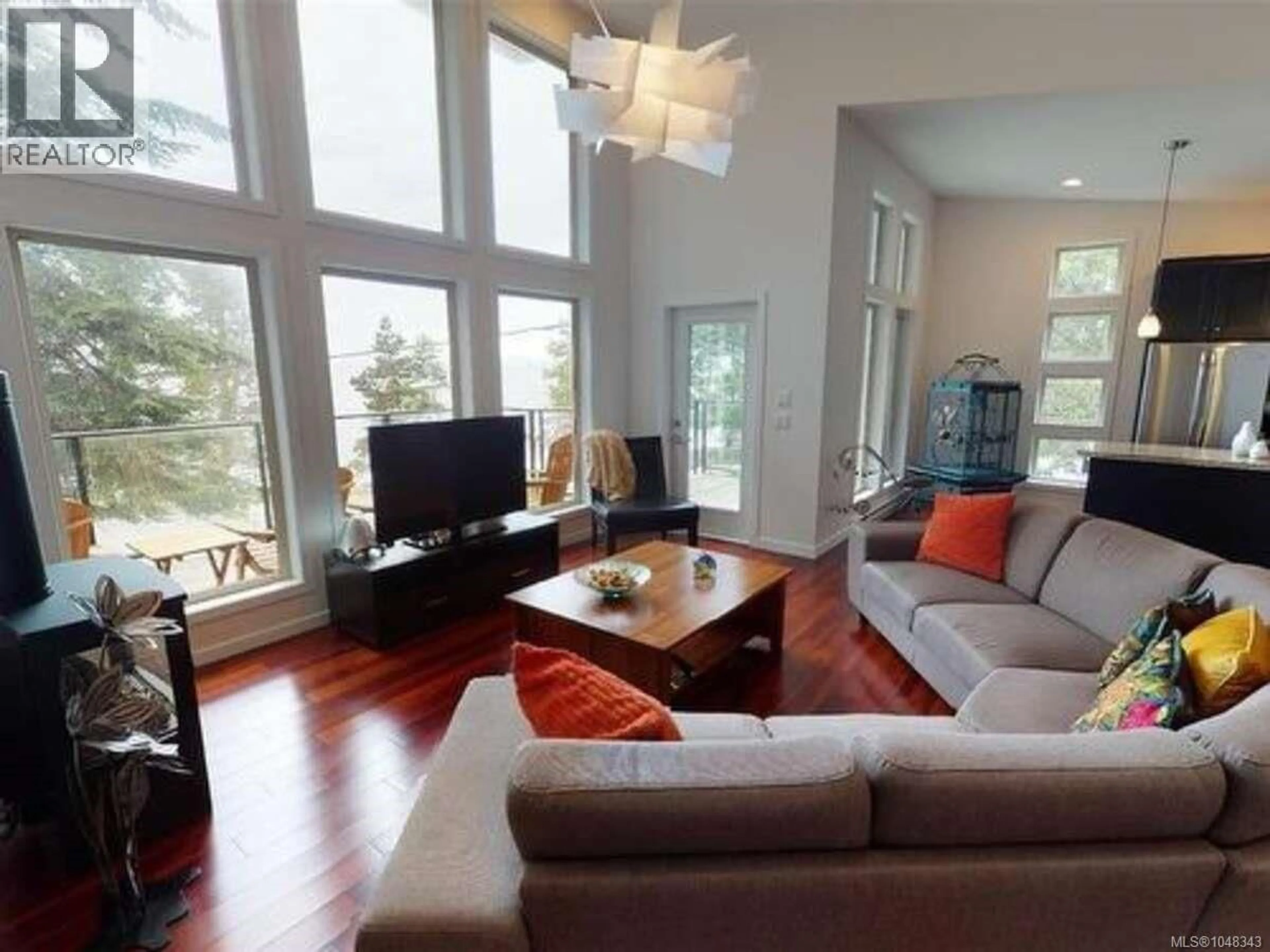 Living room with furniture, wood/laminate floor for 733 BERRY POINT ROAD, Gabriola Island British Columbia V0R1X1