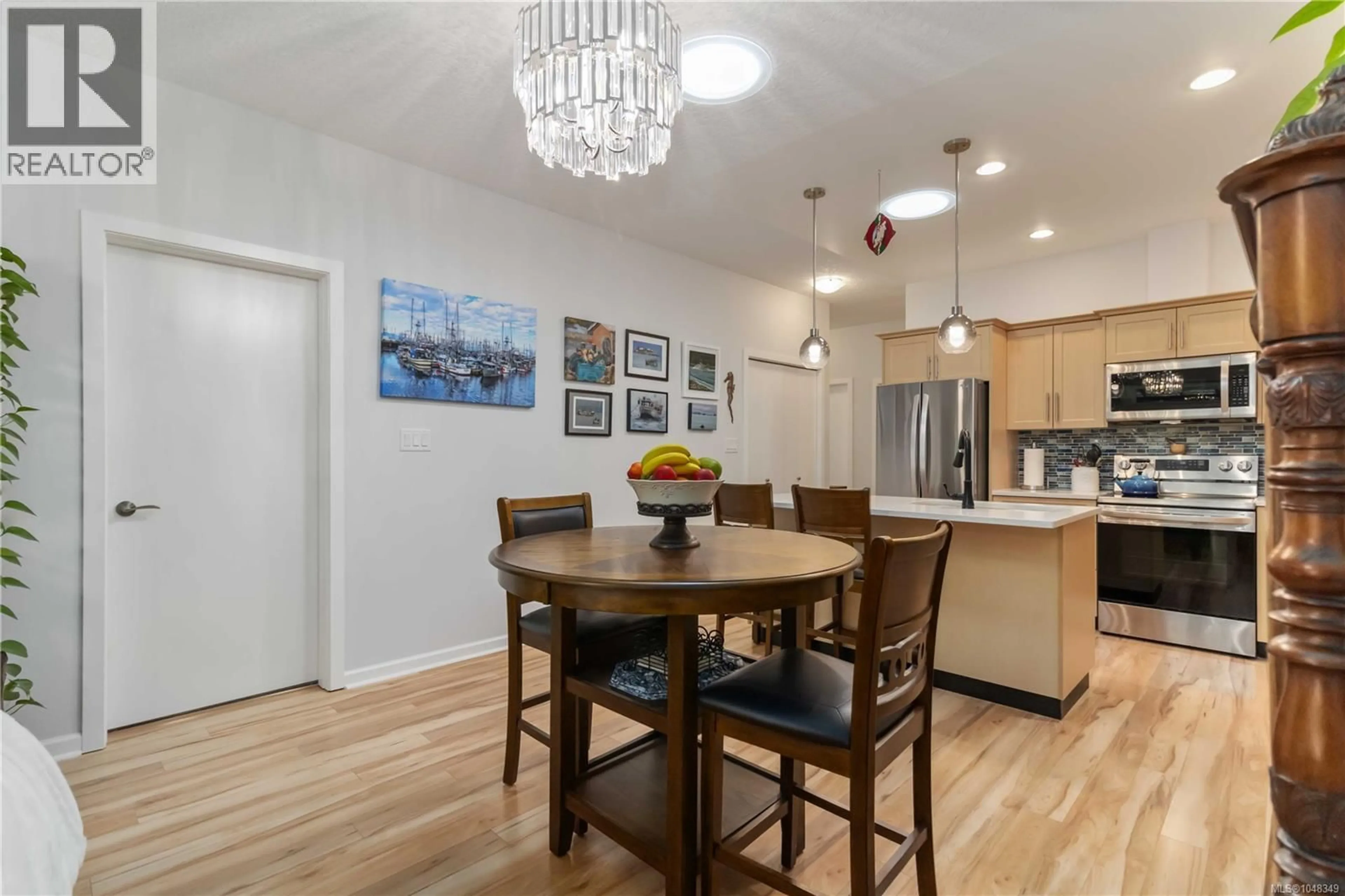 Open concept kitchen, wood/laminate floor for 6373 SHAMBROOK DRIVE, Sooke British Columbia V9Z1N9