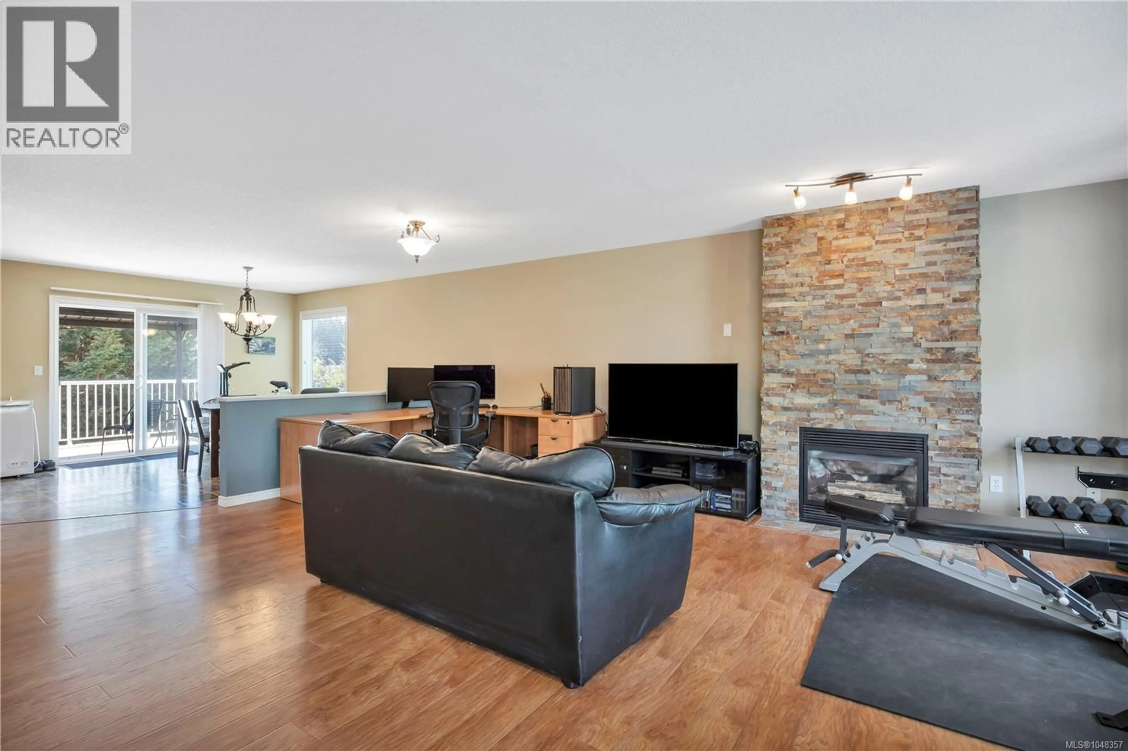 Living room with furniture, wood/laminate floor for 4771 FAIRBROOK CRESCENT, Nanaimo British Columbia V9T6M6