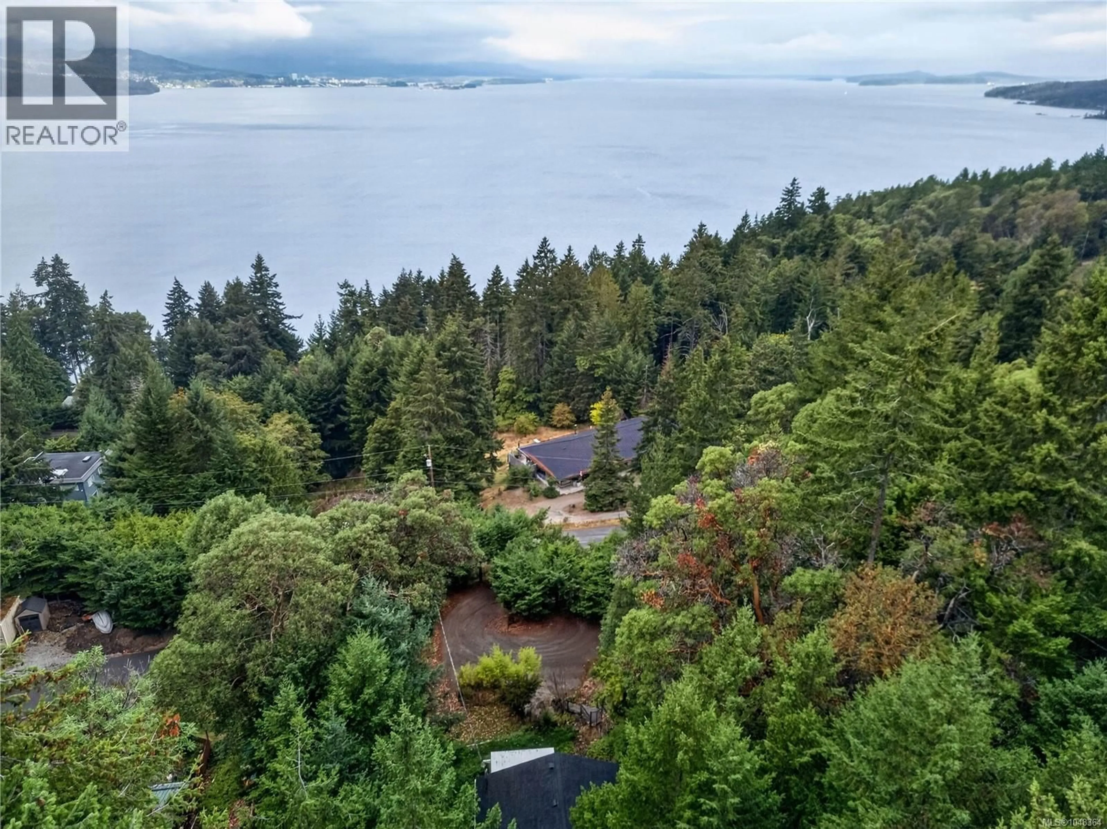 A pic from outside/outdoor area/front of a property/back of a property/a pic from drone, water/lake/river/ocean view for 321 COLLINS ROAD, Salt Spring British Columbia V8K2N1