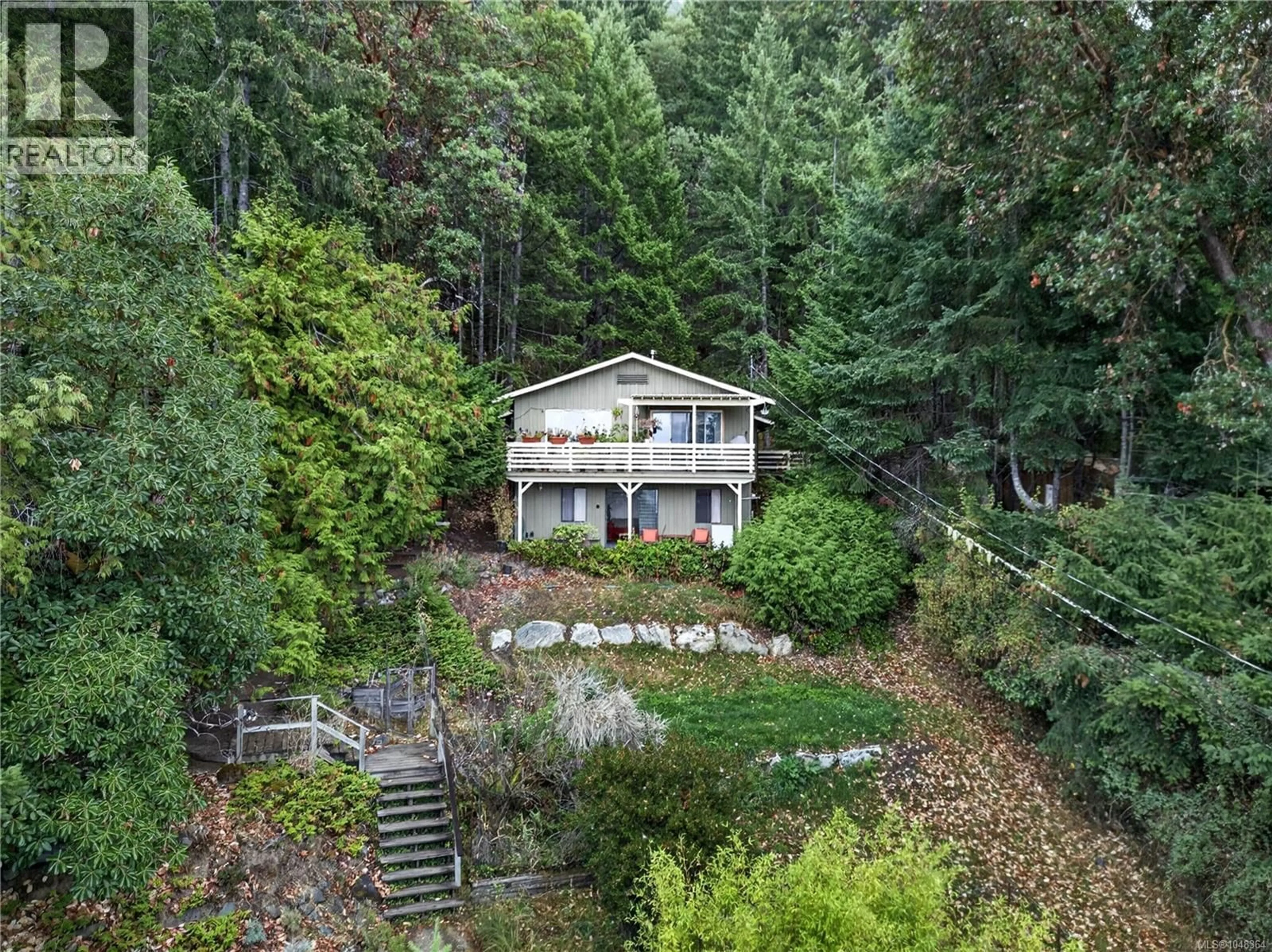 A pic from outside/outdoor area/front of a property/back of a property/a pic from drone, forest/trees view for 321 COLLINS ROAD, Salt Spring British Columbia V8K2N1