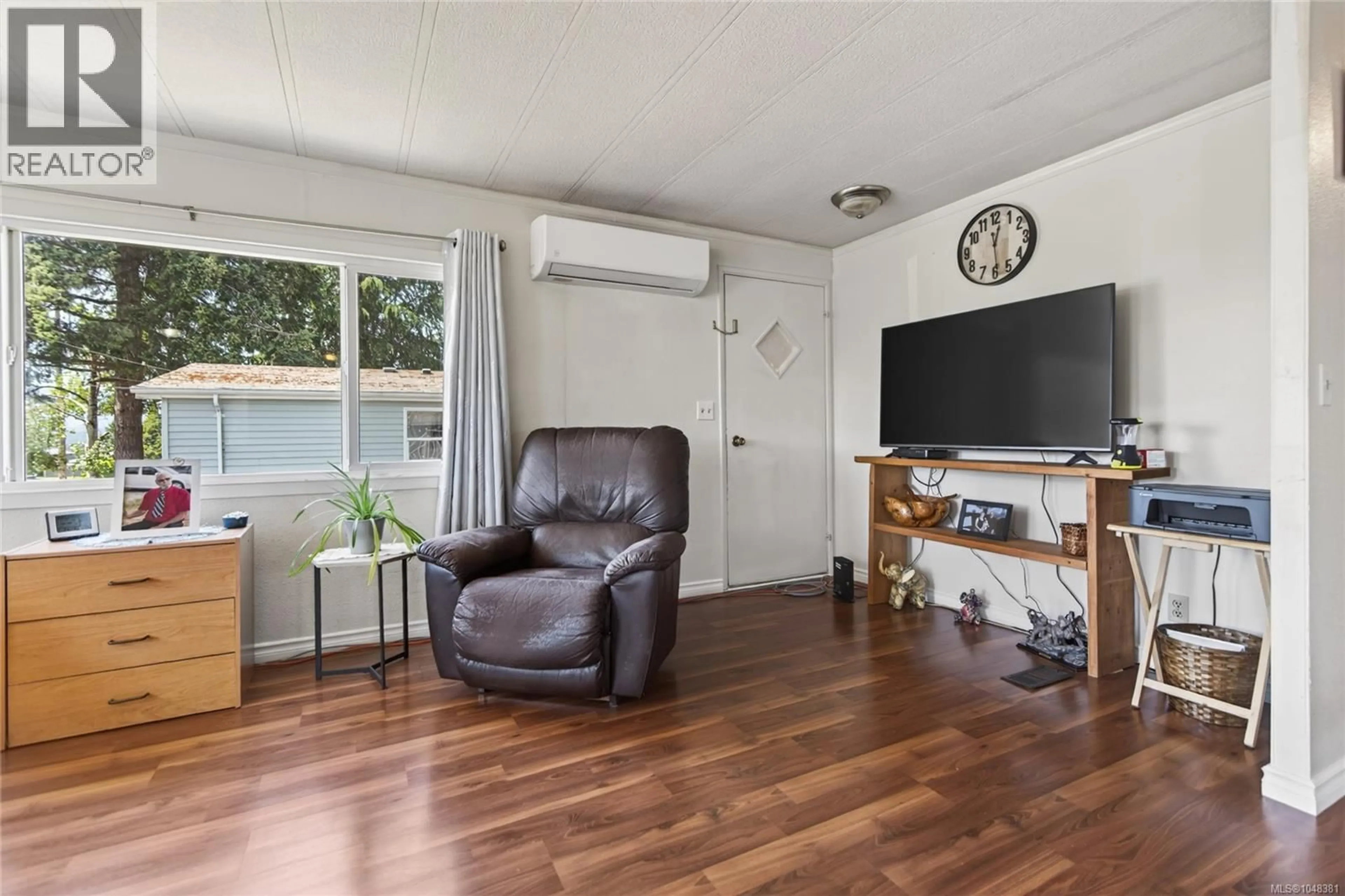 Living room with furniture, wood/laminate floor for 2068 4TH STREET EAST, Courtenay British Columbia V9N6V8