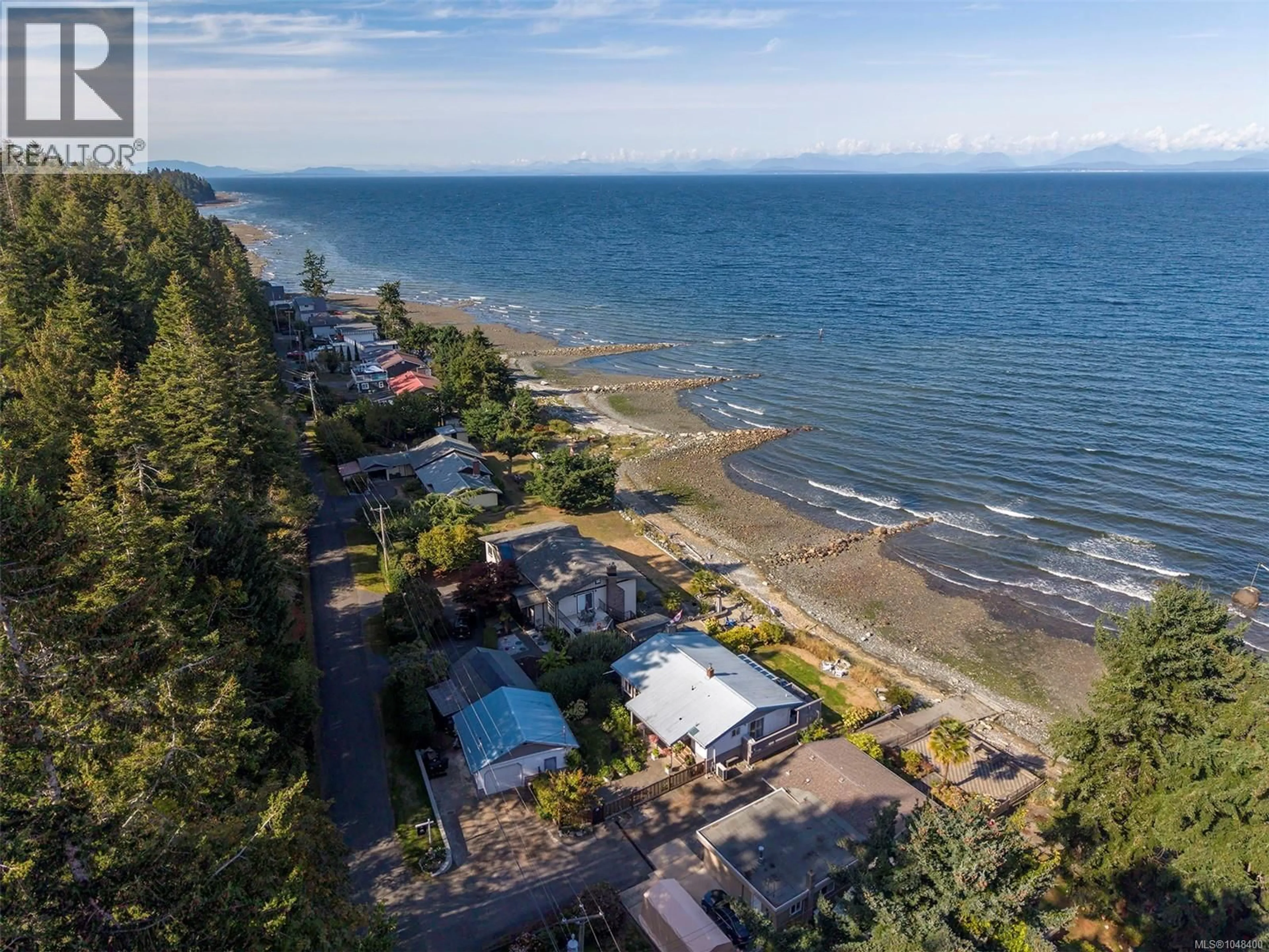 A pic from outside/outdoor area/front of a property/back of a property/a pic from drone, water/lake/river/ocean view for 1442 WILKINSON ROAD, Comox British Columbia V9M4B3