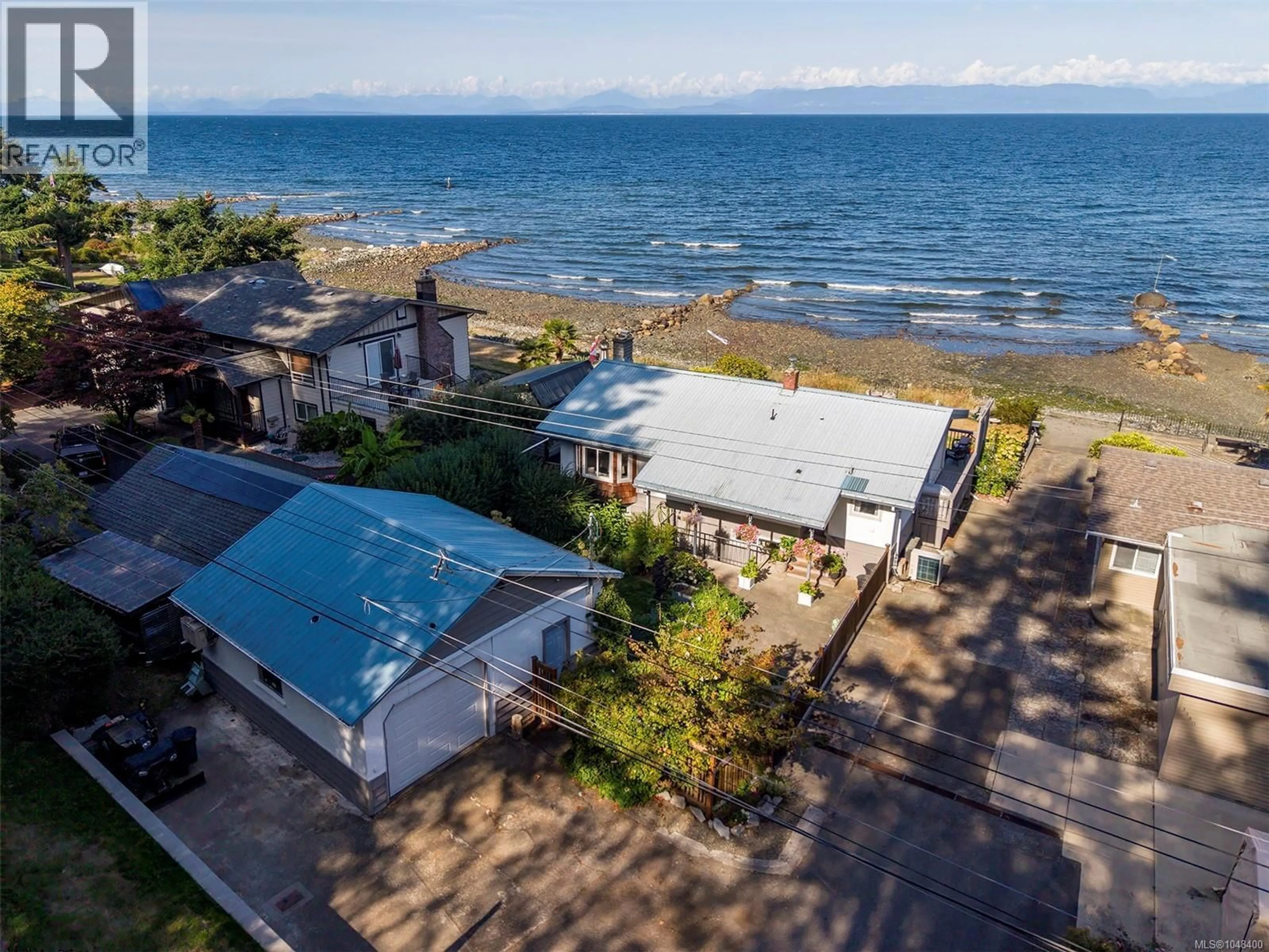 A pic from outside/outdoor area/front of a property/back of a property/a pic from drone, water/lake/river/ocean view for 1442 WILKINSON ROAD, Comox British Columbia V9M4B3
