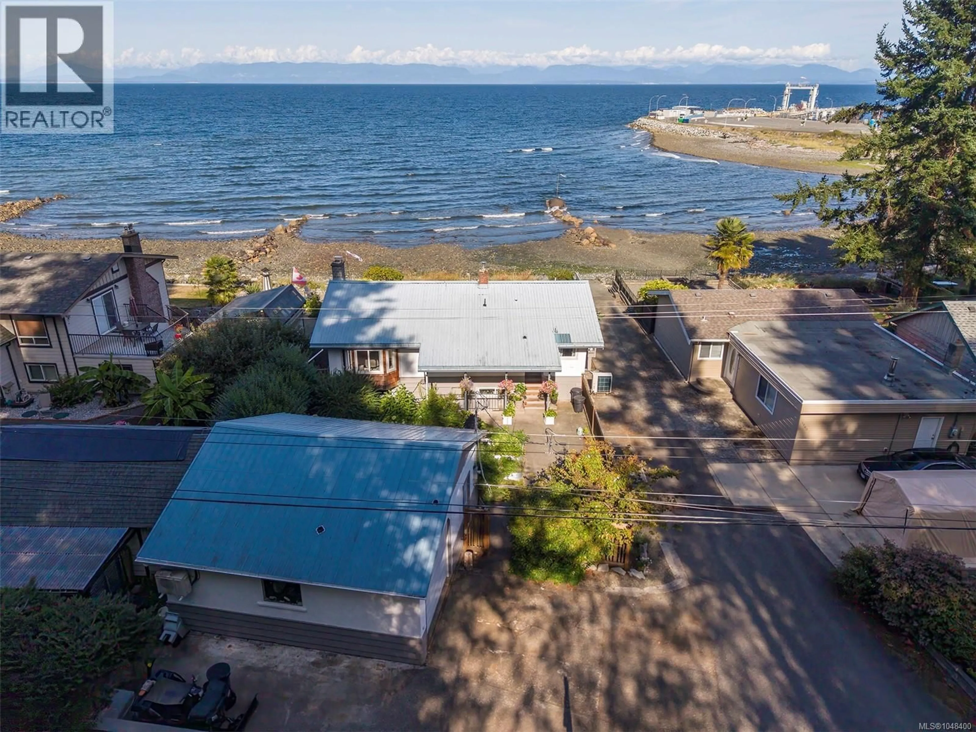 A pic from outside/outdoor area/front of a property/back of a property/a pic from drone, water/lake/river/ocean view for 1442 WILKINSON ROAD, Comox British Columbia V9M4B3