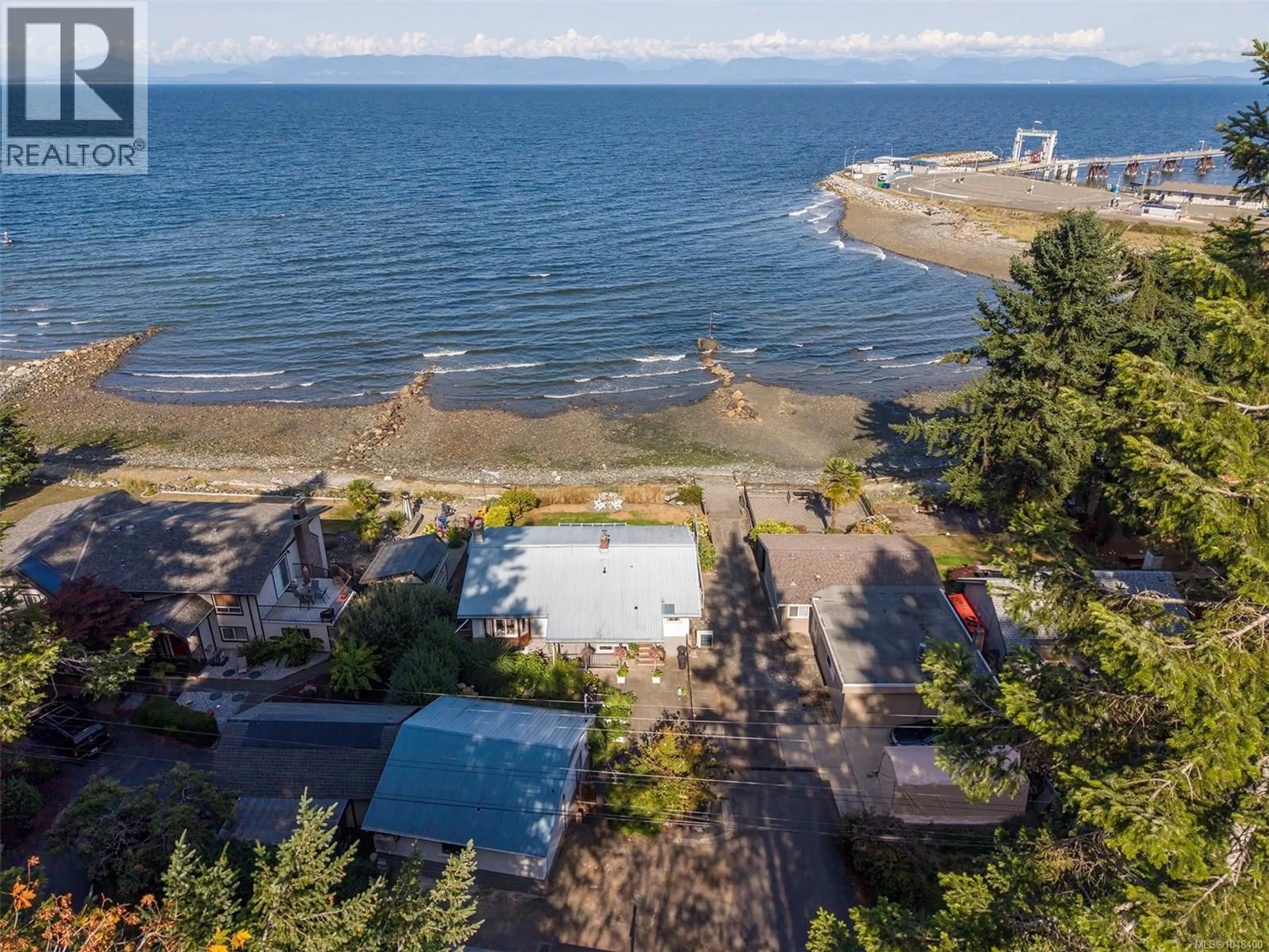 A pic from outside/outdoor area/front of a property/back of a property/a pic from drone, water/lake/river/ocean view for 1442 WILKINSON ROAD, Comox British Columbia V9M4B3