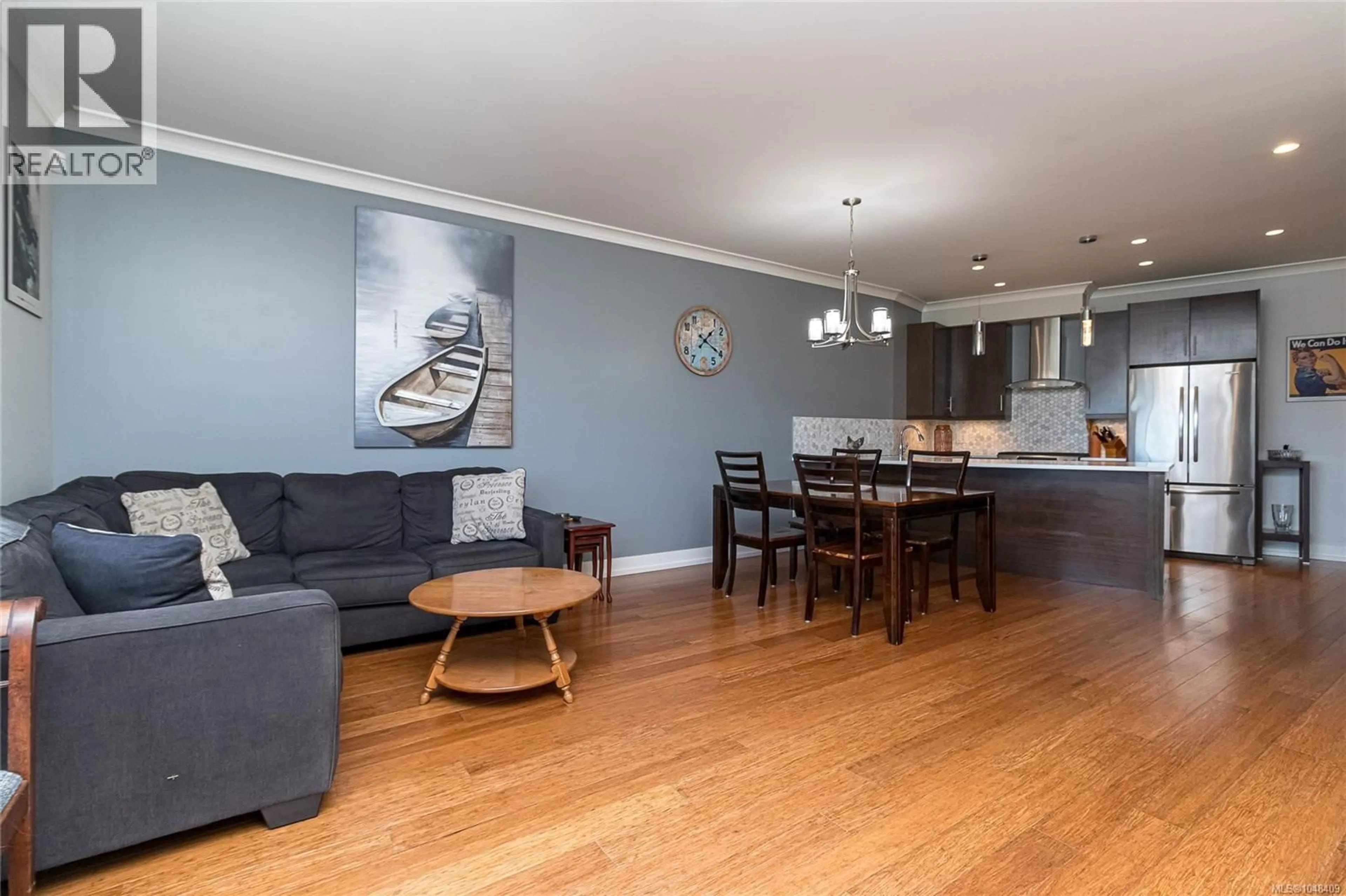 Open concept kitchen, wood/laminate floor for 7 - 2321 ISLAND VIEW ROAD, Central Saanich British Columbia V8Z0C9