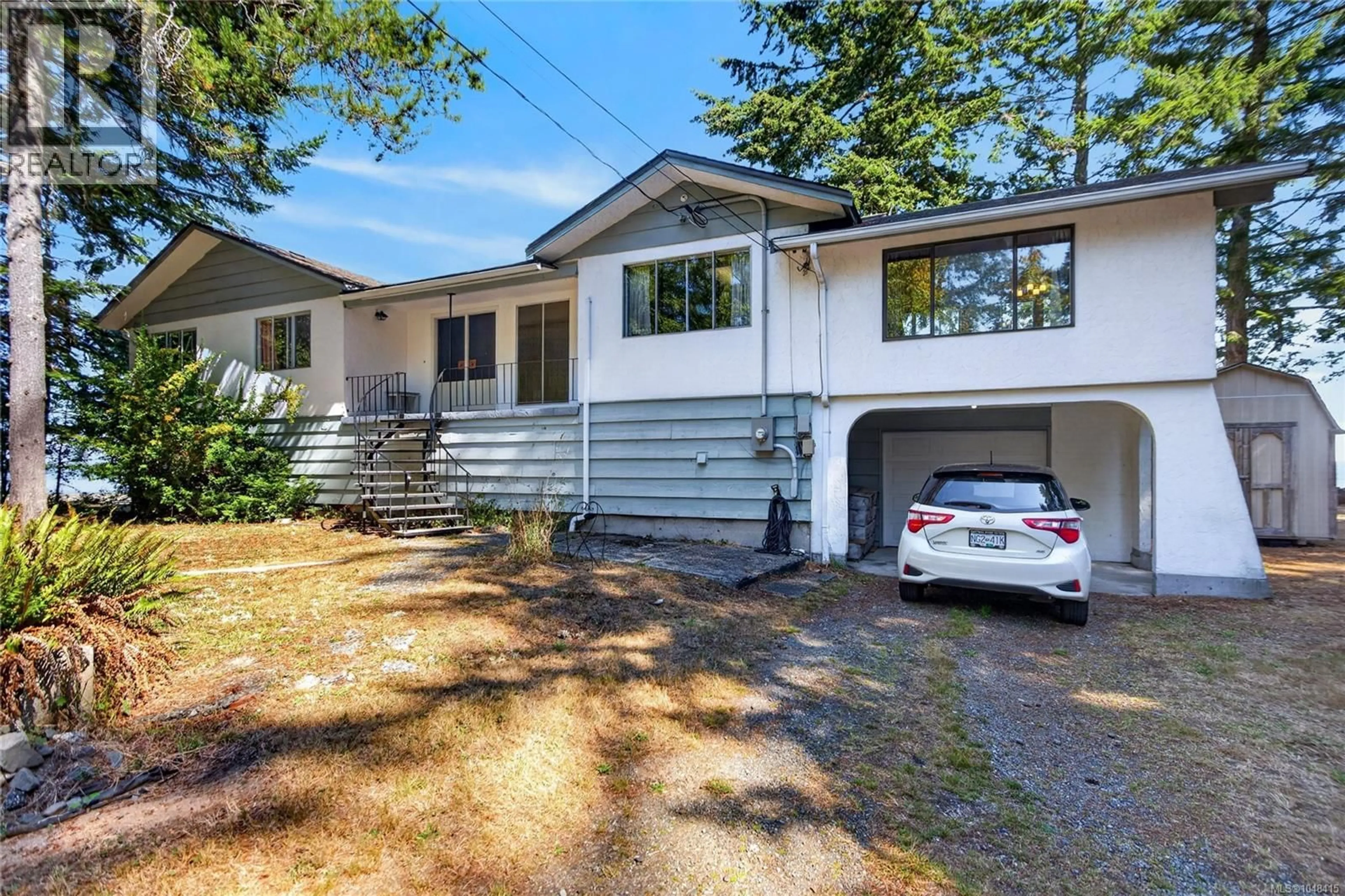 Home with vinyl exterior material, street for 1394 SEAVIEW ROAD, Black Creek British Columbia V0R1C0